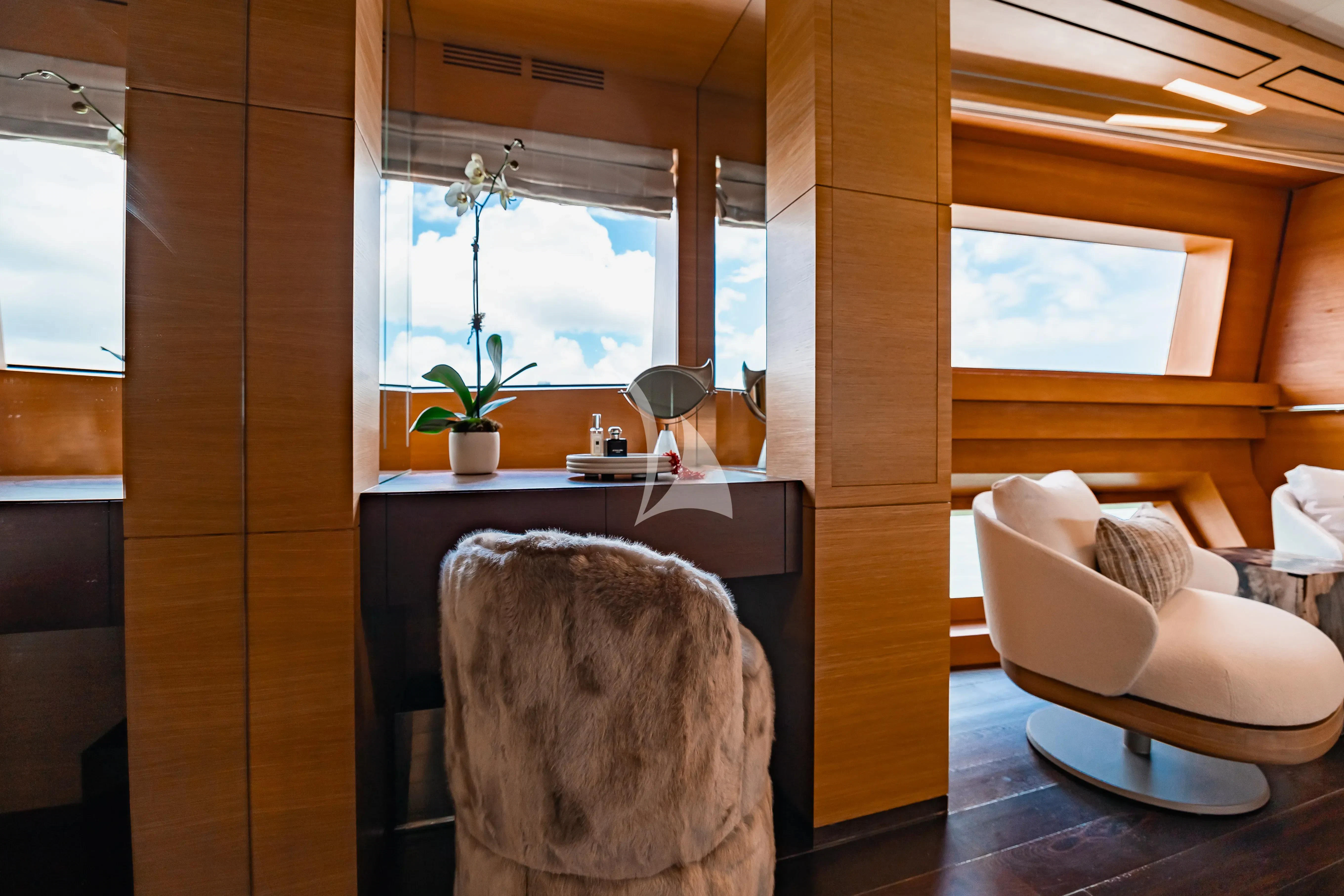 a living room with a fireplace aboard PATIENCE Yacht for Charter