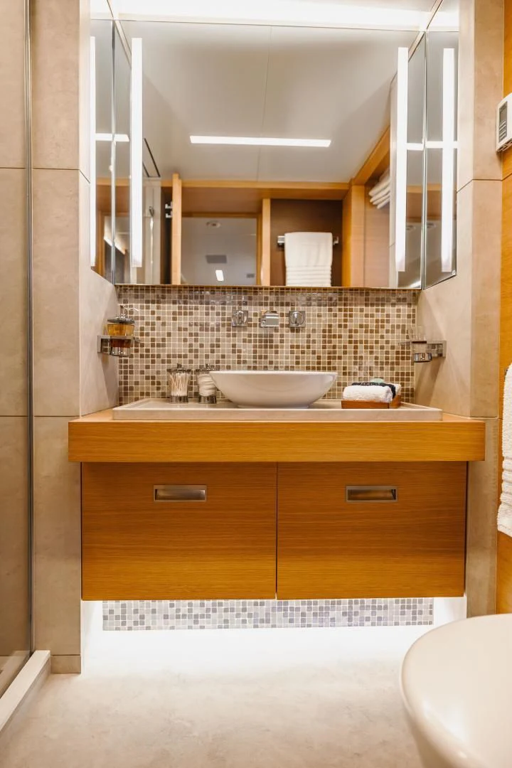a bathroom with a large mirror aboard PATIENCE Yacht for Charter