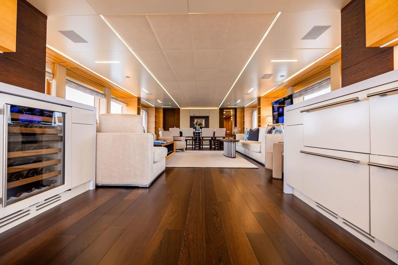 a room with a wood floor and a large fireplace aboard PATIENCE Yacht for Charter