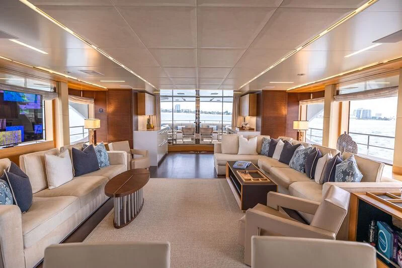 a living room with a large window aboard PATIENCE Yacht for Charter