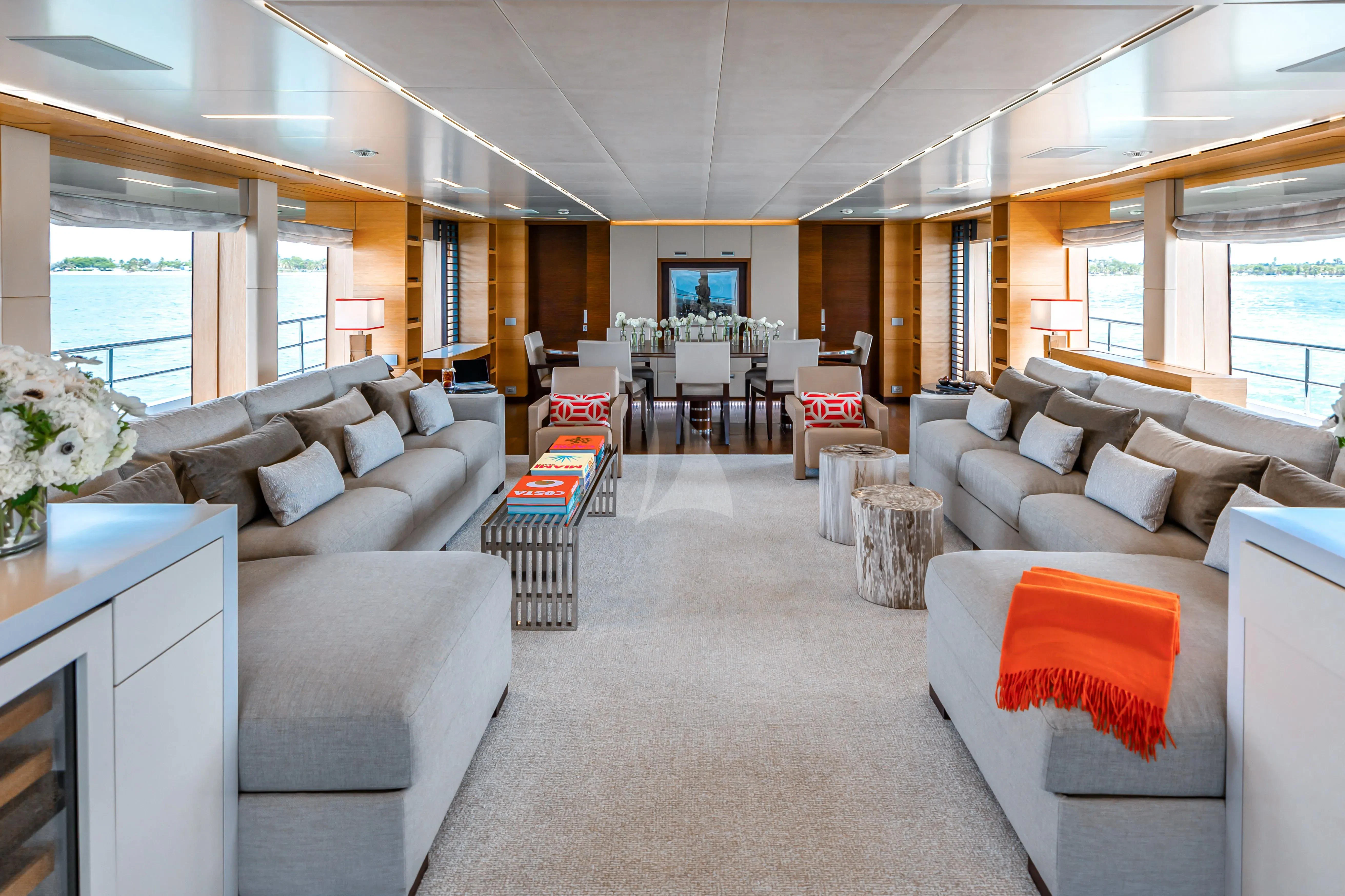 a living room with a large window aboard PATIENCE Yacht for Charter