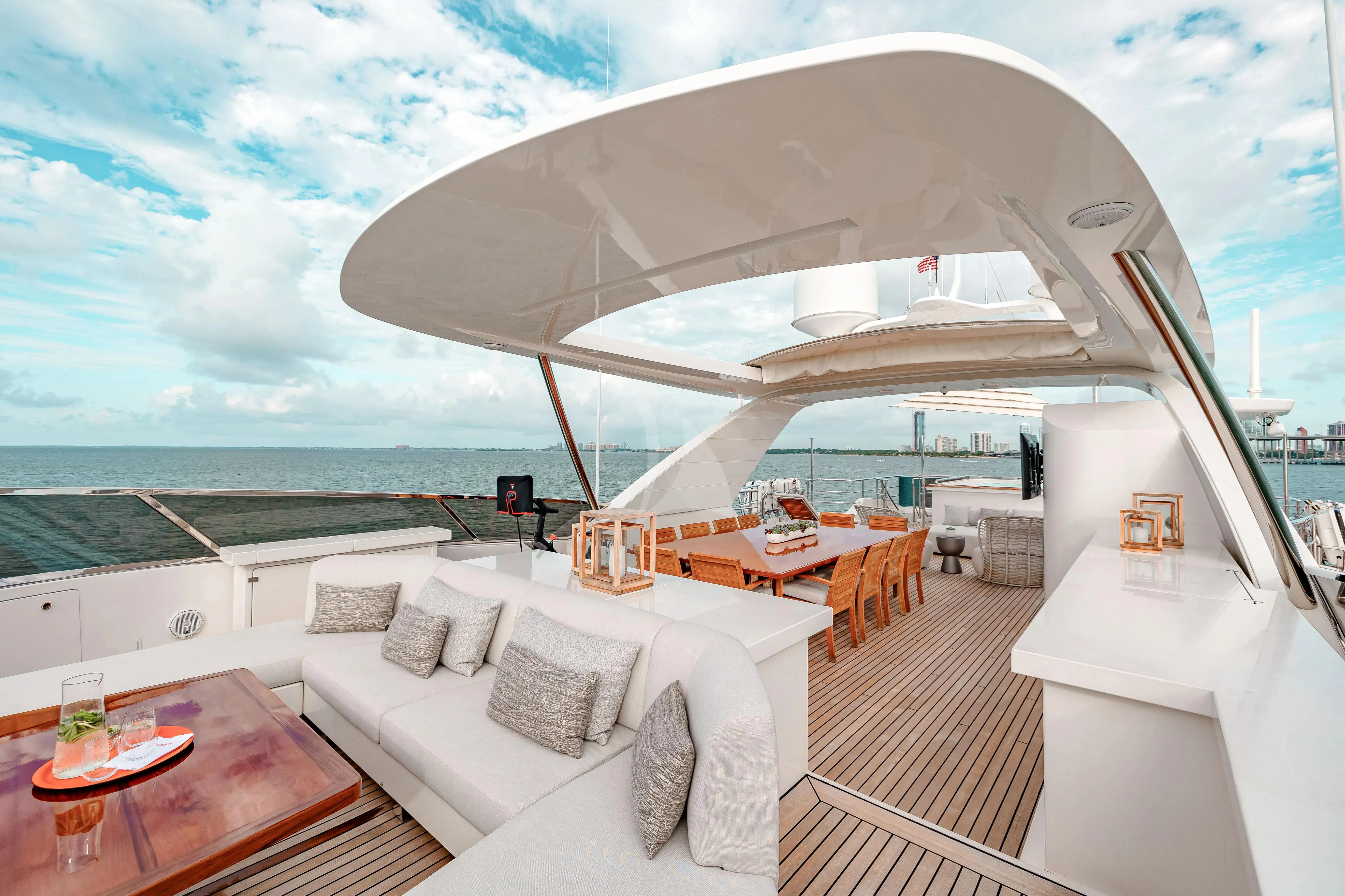 a room with a couch and a table and a large white sofa aboard PATIENCE Yacht for Charter