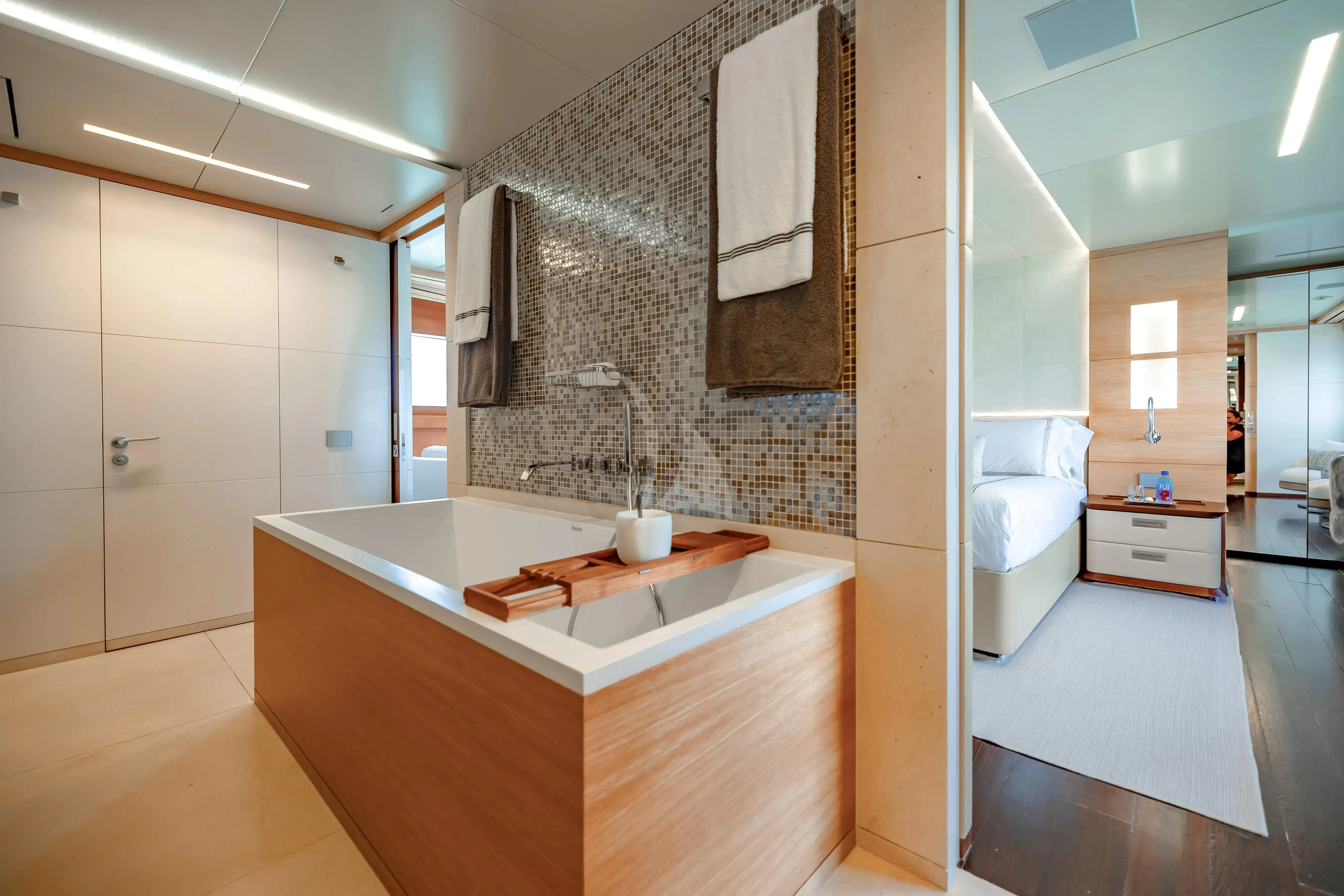 a bathroom with a bathtub and sink aboard PATIENCE Yacht for Charter