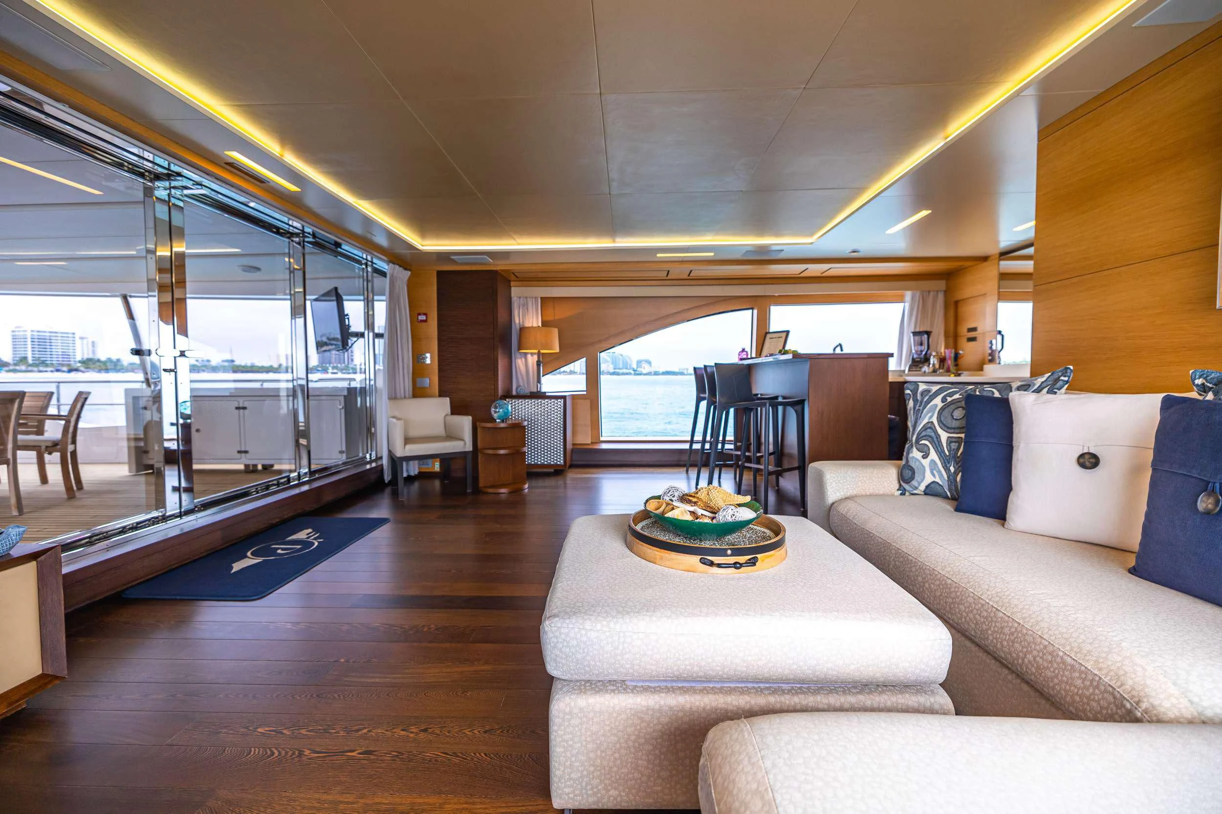 a living room with a large glass window aboard PATIENCE Yacht for Charter
