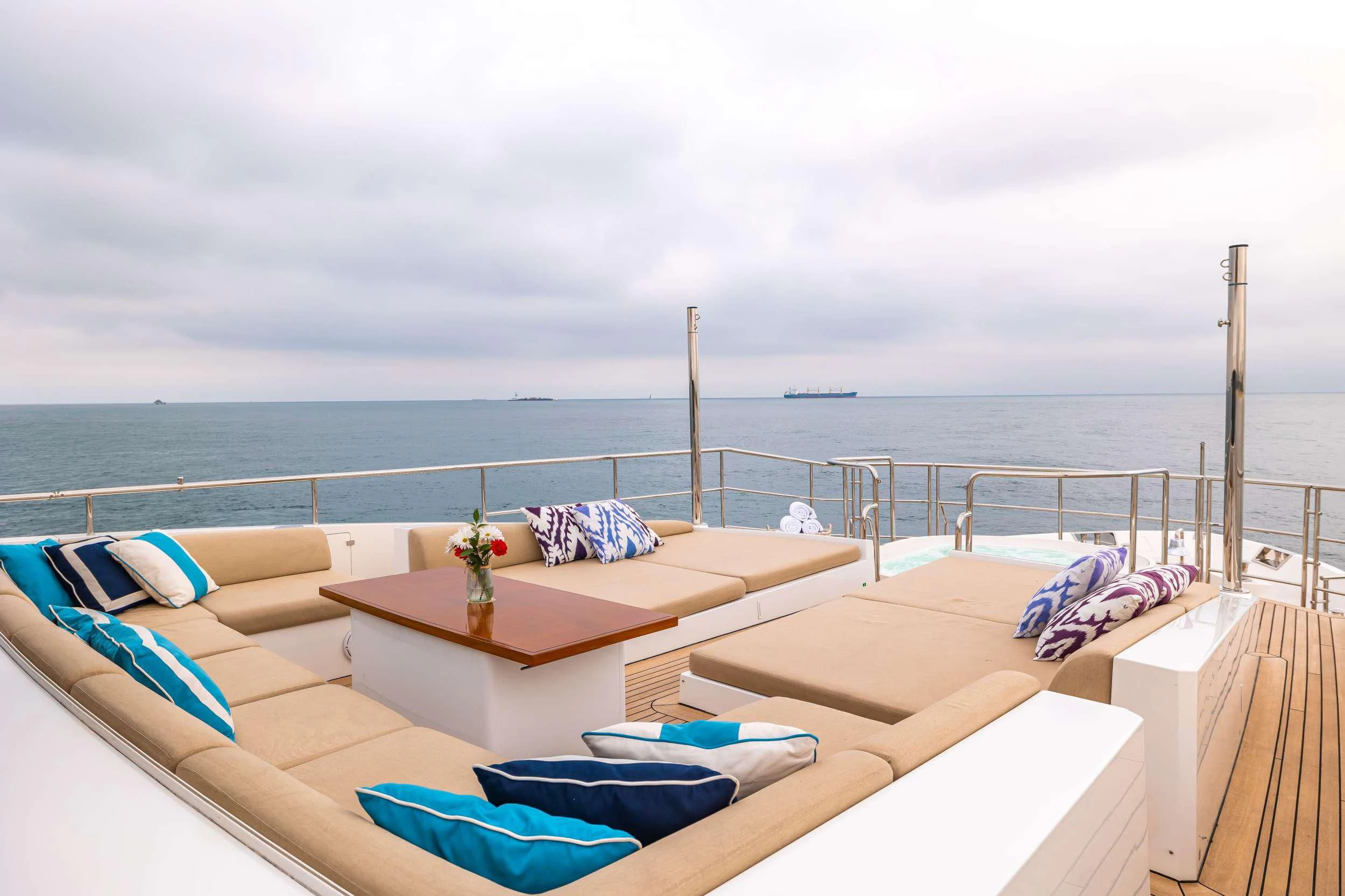 a balcony with a view of the ocean and the ocean aboard PATIENCE Yacht for Charter