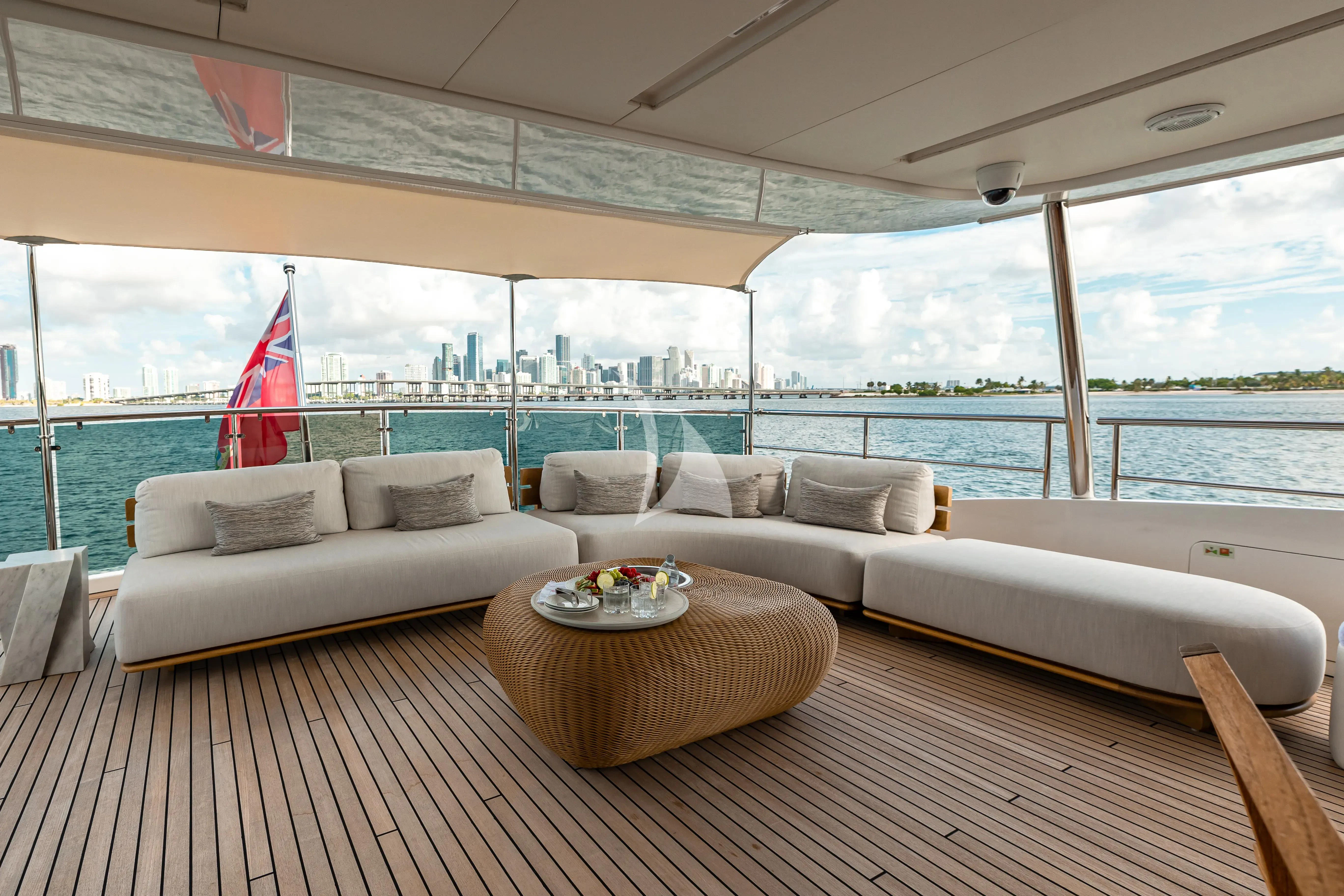 a living room with a large window aboard PATIENCE Yacht for Charter