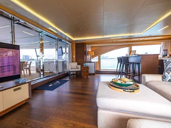 a living room with a large window aboard PATIENCE Yacht for Charter