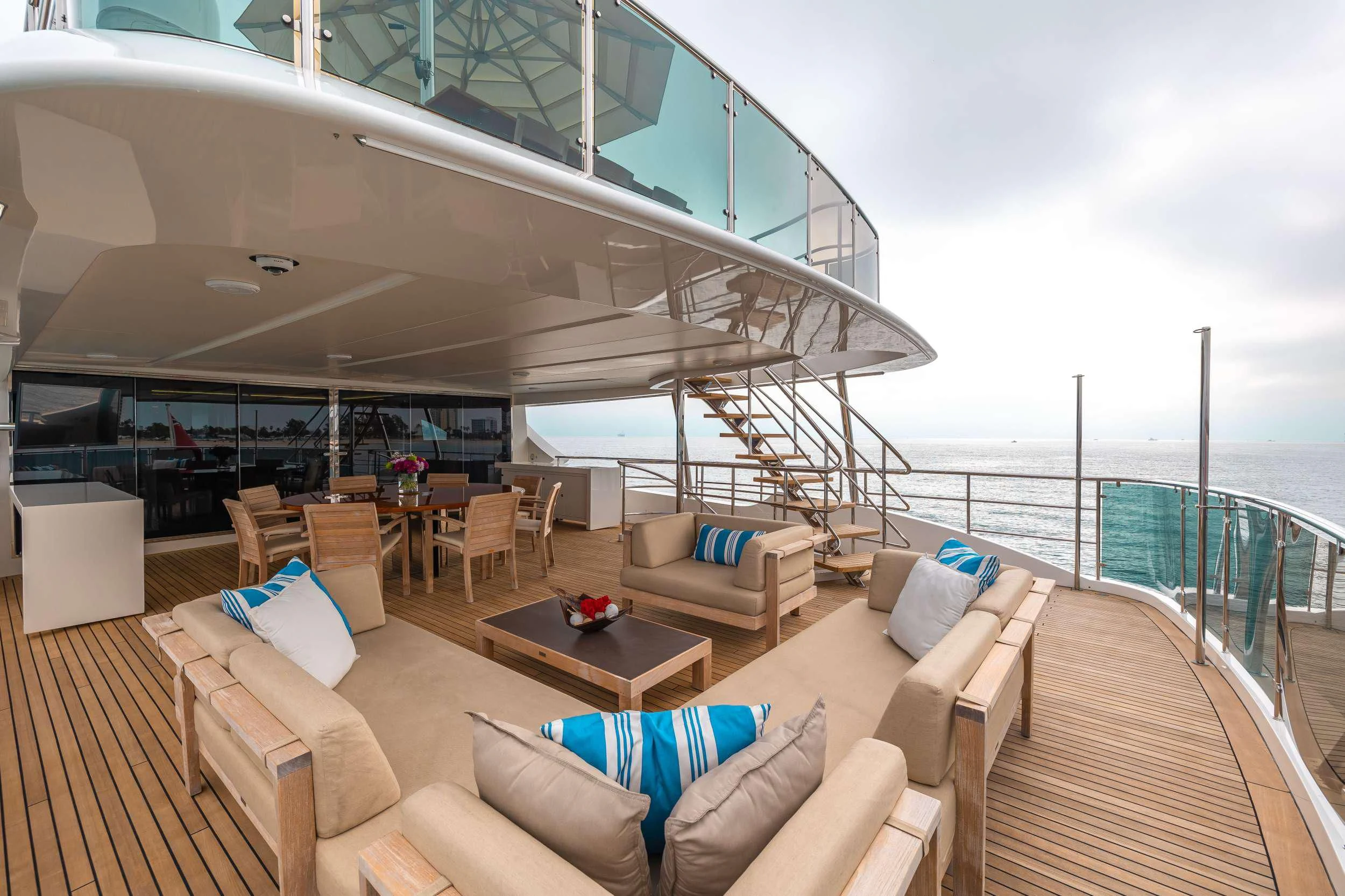 a large living room with a large balcony aboard PATIENCE Yacht for Charter