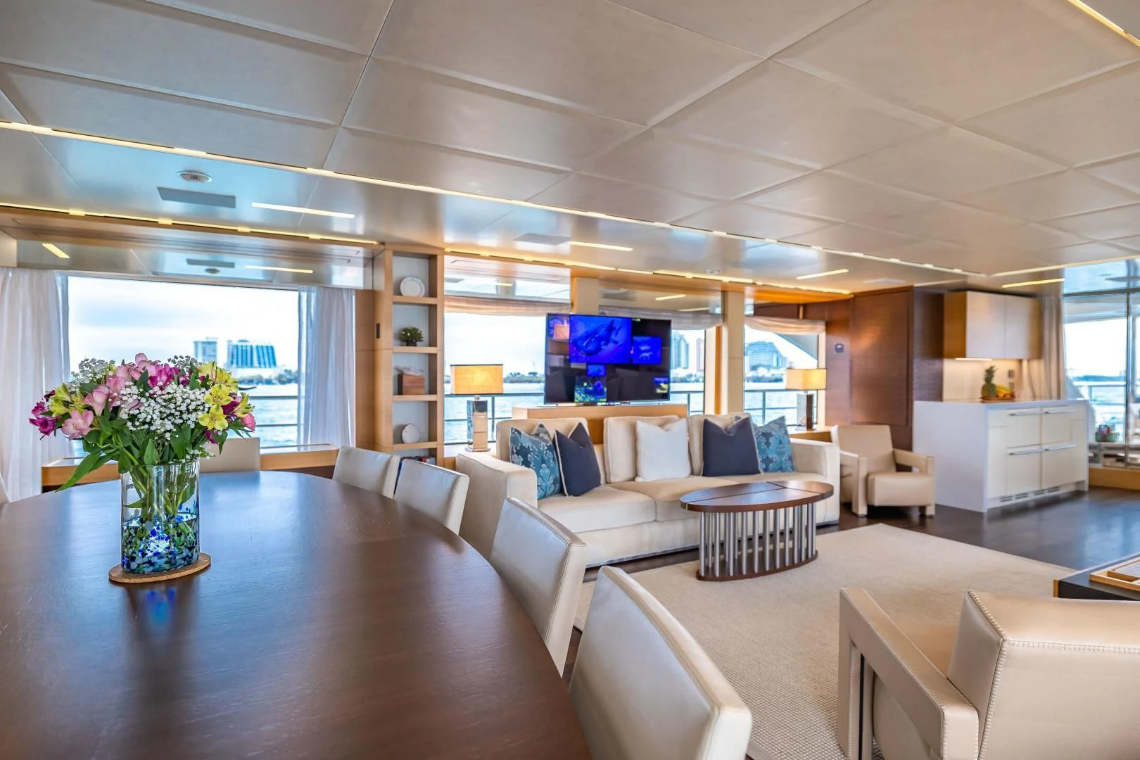 a living room with a large window aboard PATIENCE Yacht for Charter