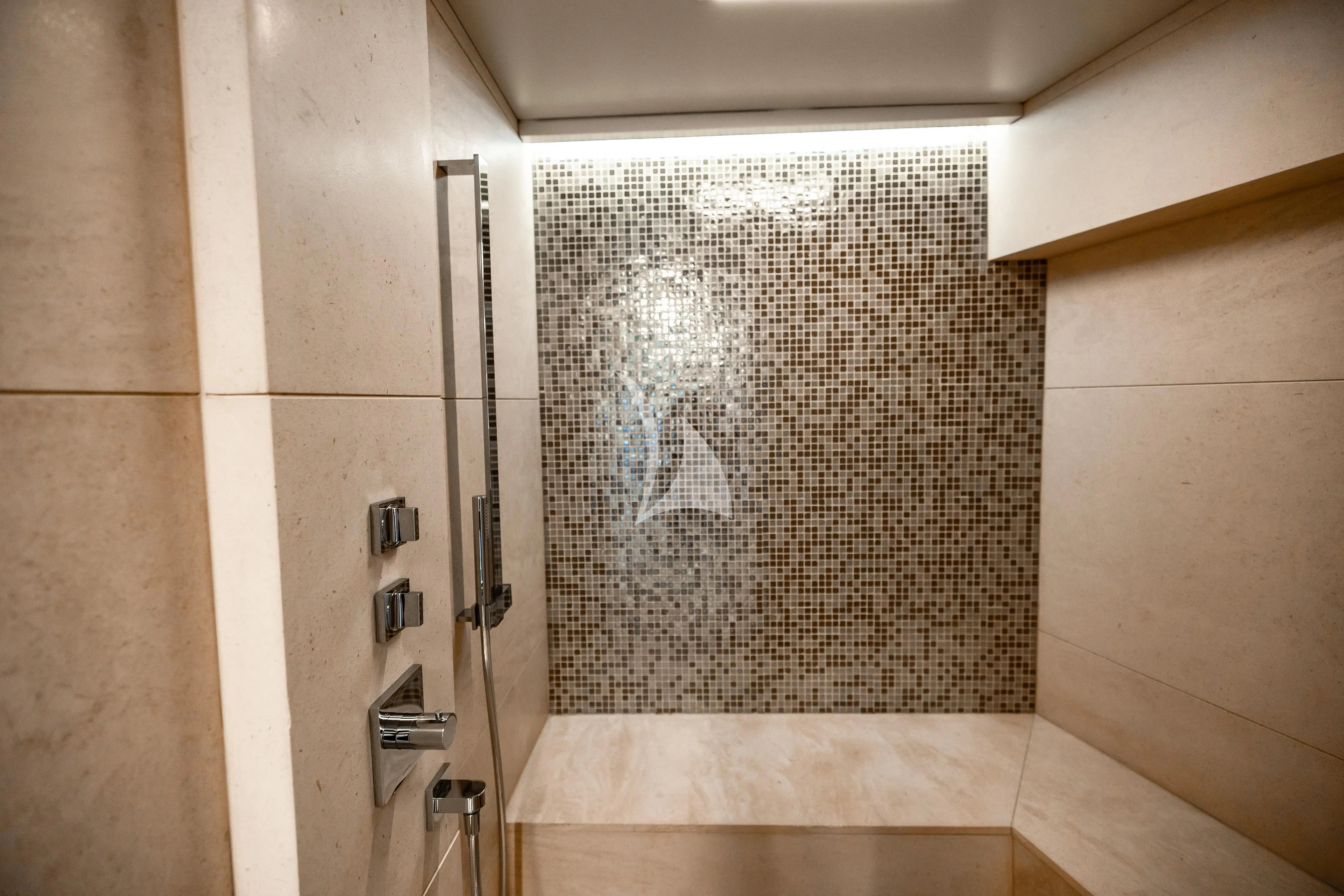 a shower unit with a glass door aboard PATIENCE Yacht for Charter