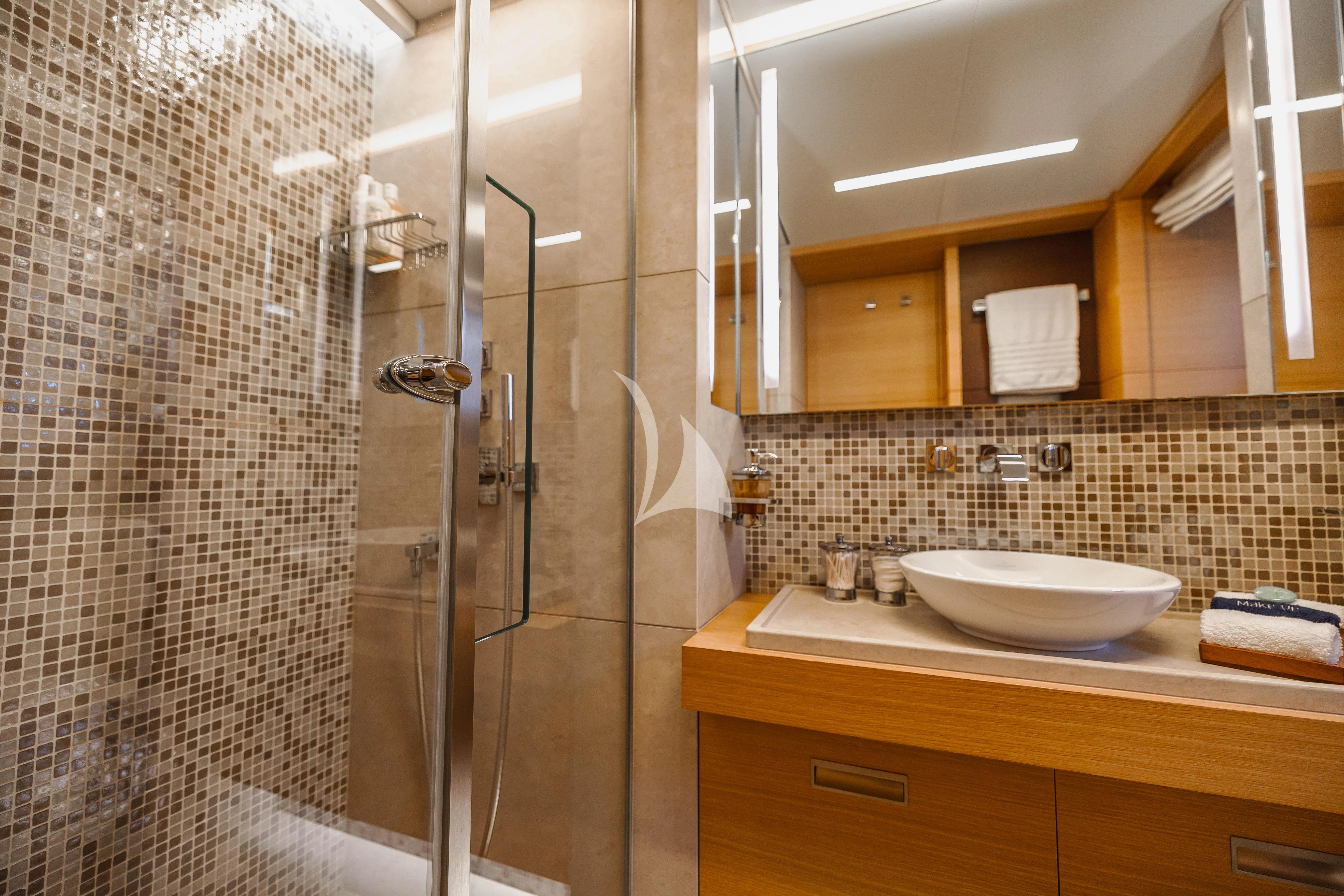a bathroom with a glass shower aboard PATIENCE Yacht for Charter