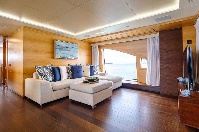a living room with a large window aboard PATIENCE Yacht for Charter