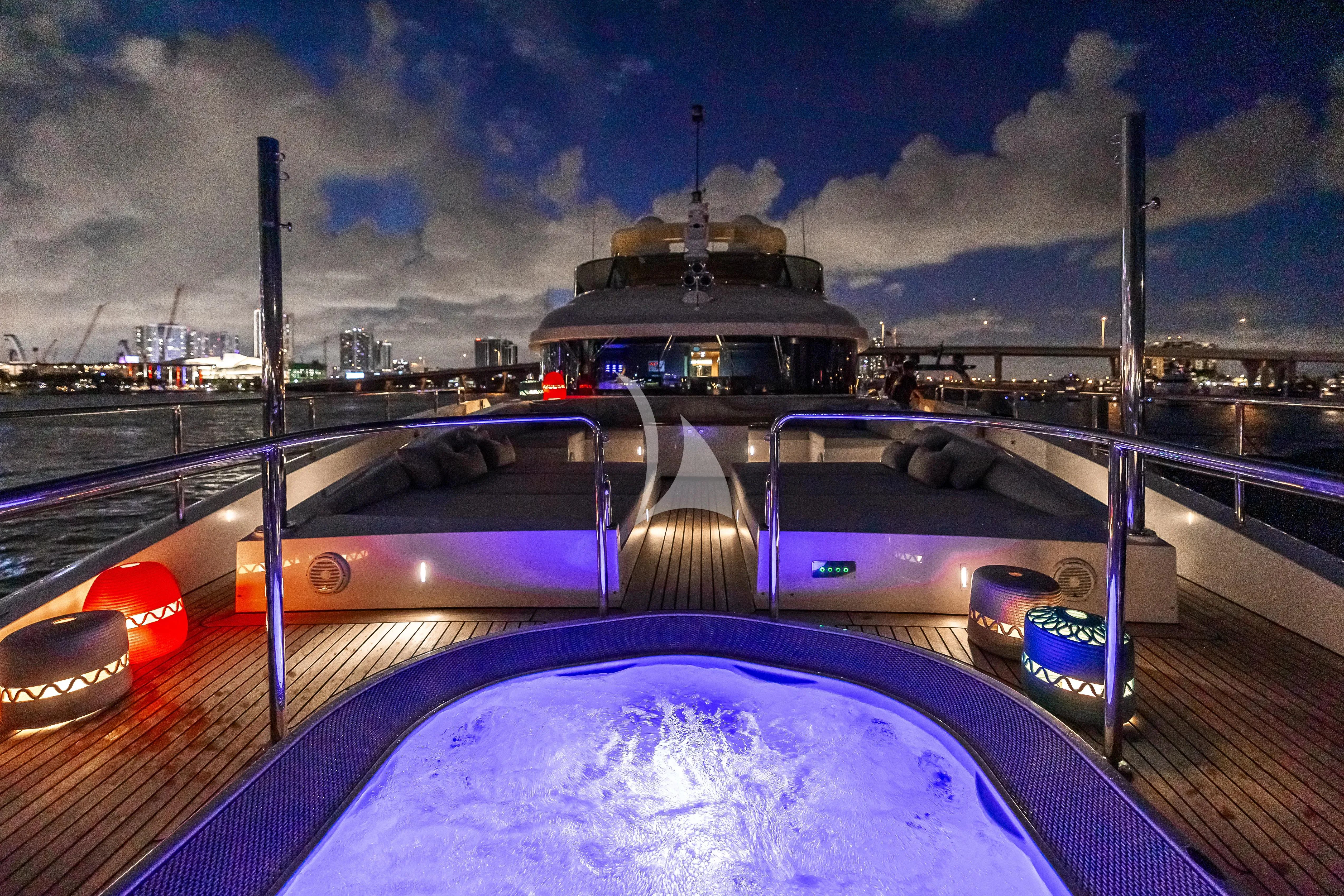 a car on a road with a ship in the background aboard PATIENCE Yacht for Charter