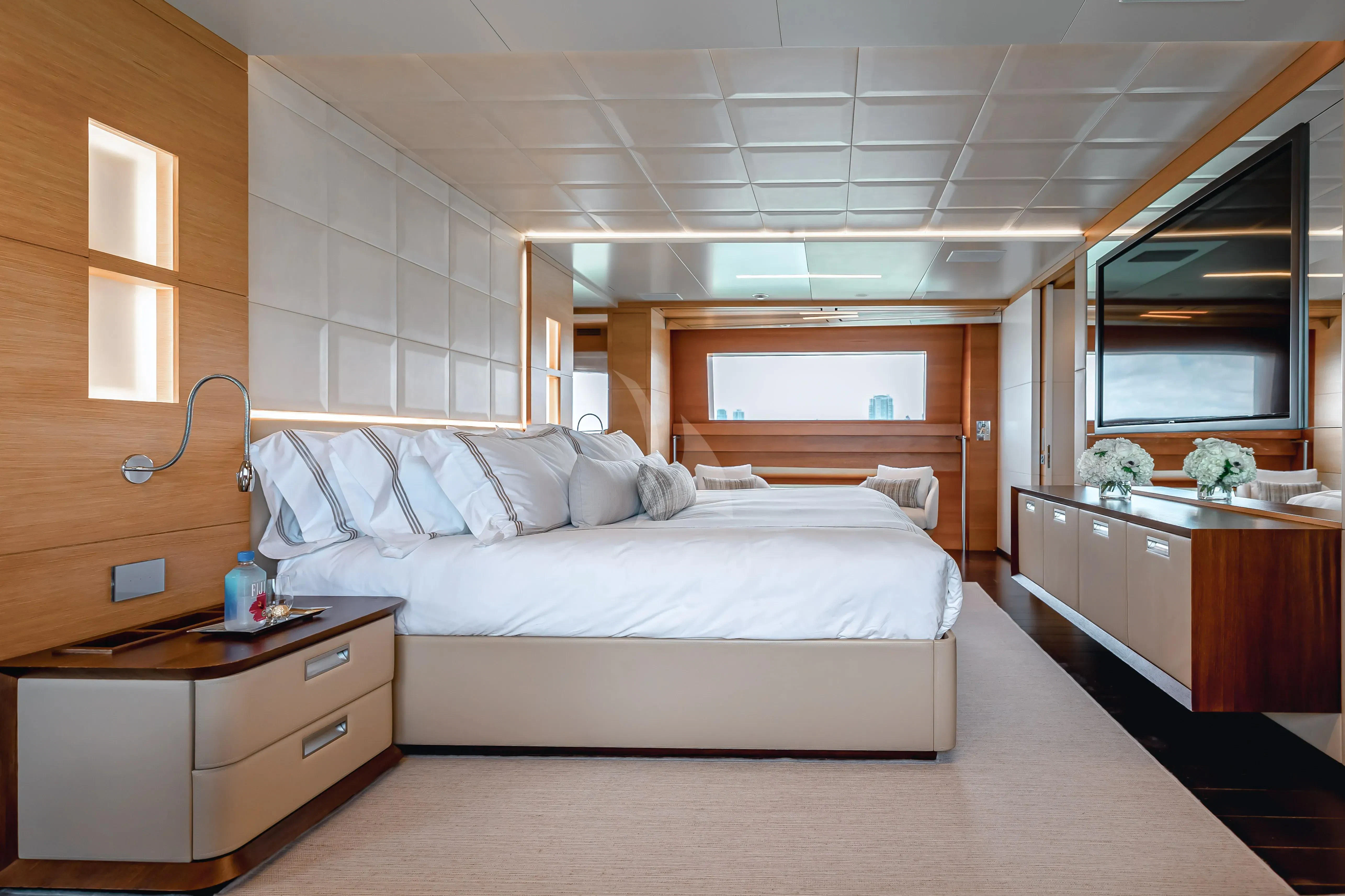 a bedroom with a bed and a desk aboard PATIENCE Yacht for Charter