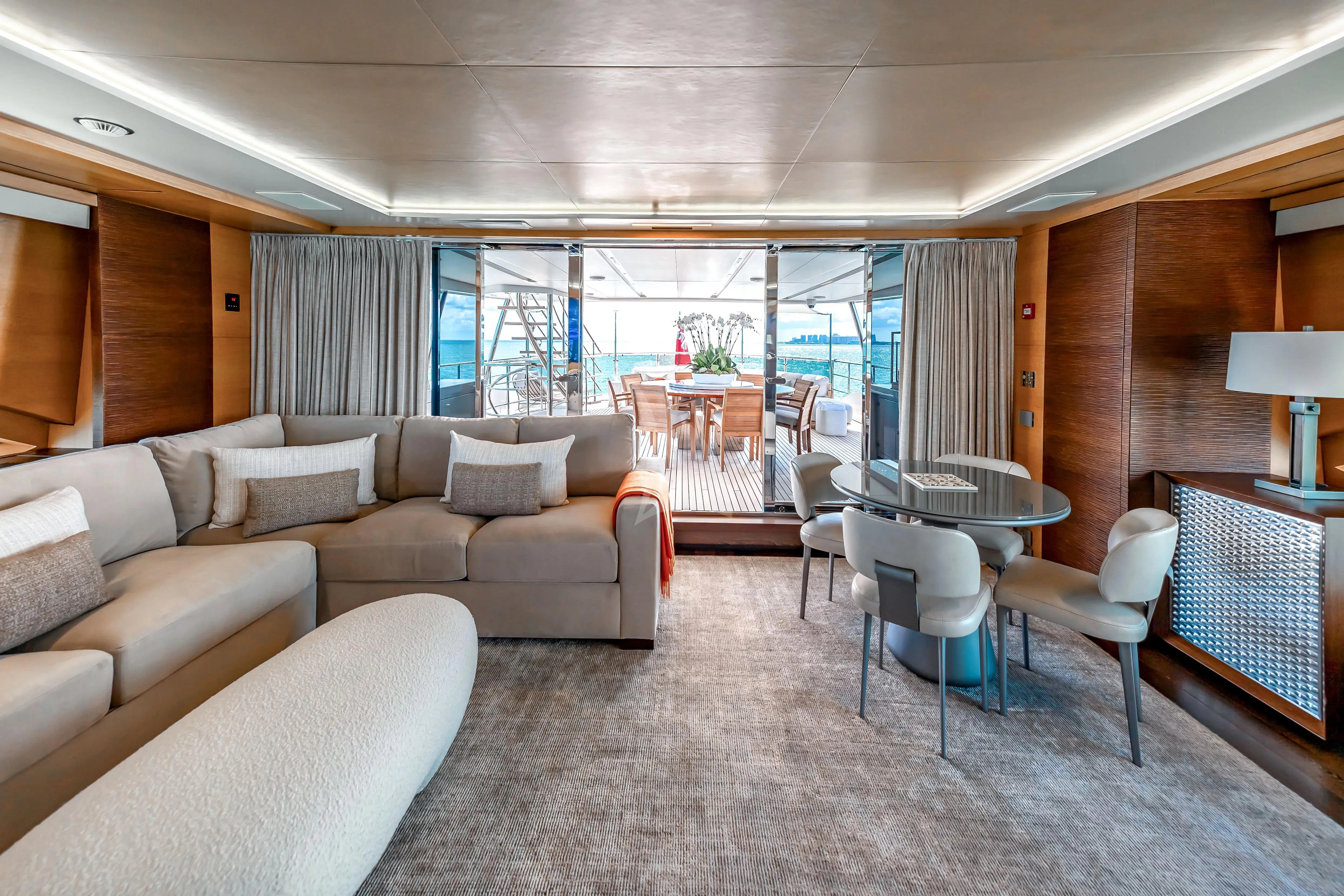 a living room with a large window aboard PATIENCE Yacht for Charter