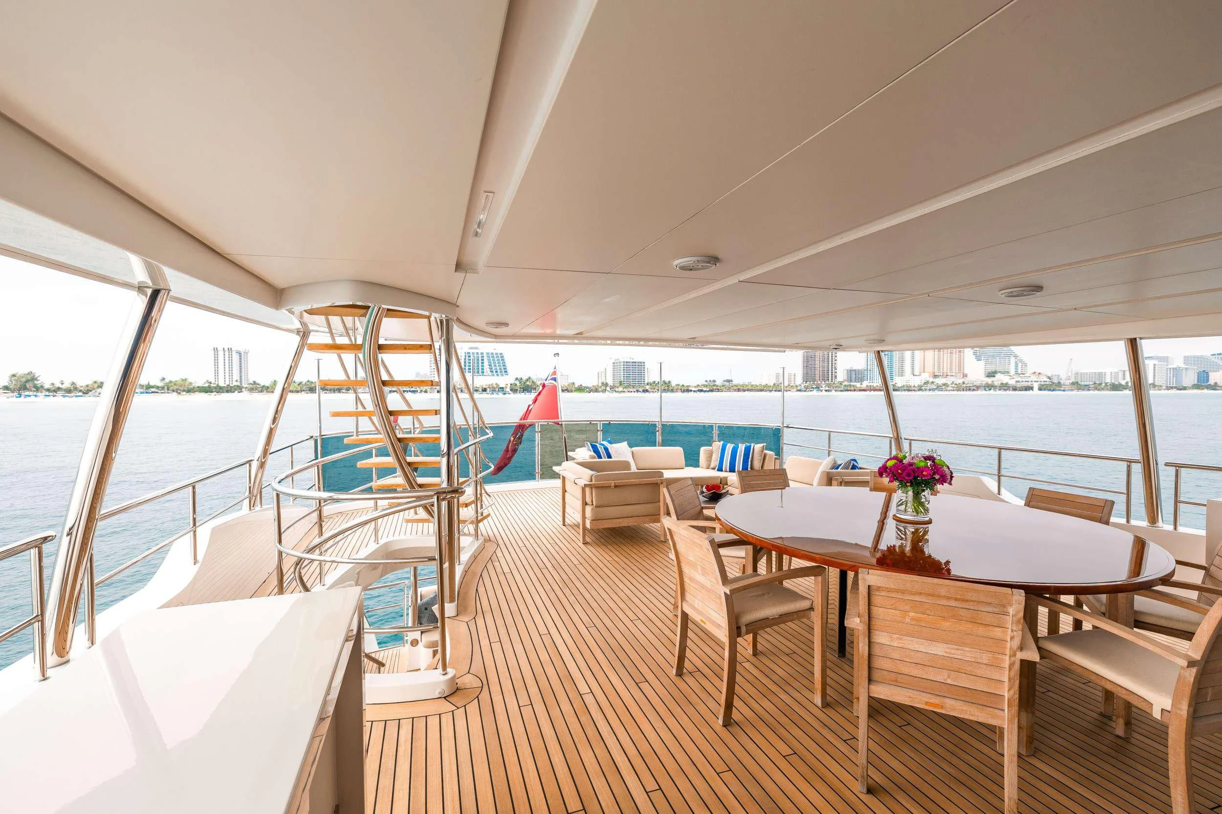 a boat with tables and chairs aboard PATIENCE Yacht for Charter