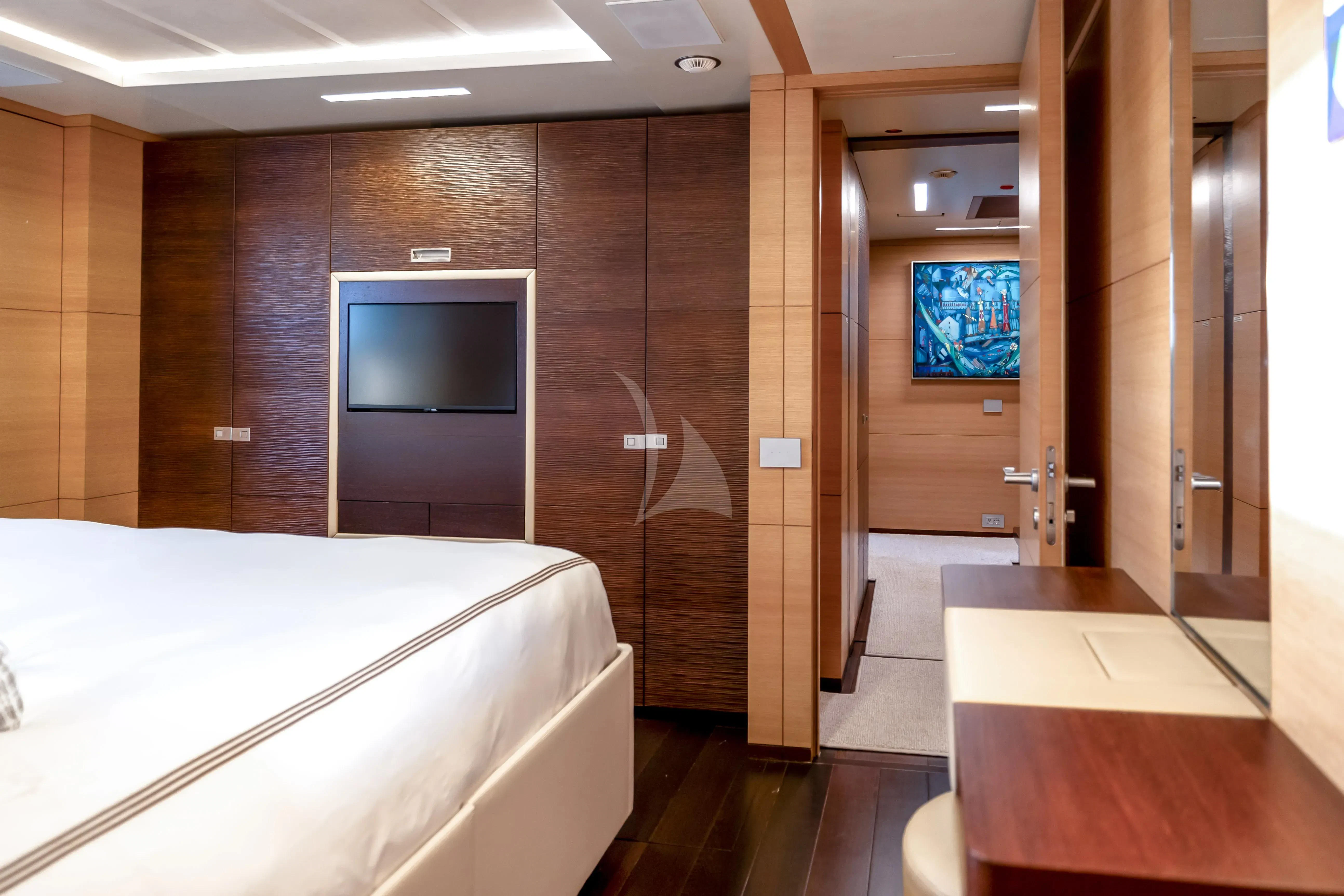 a room with a bed and a desk aboard PATIENCE Yacht for Charter