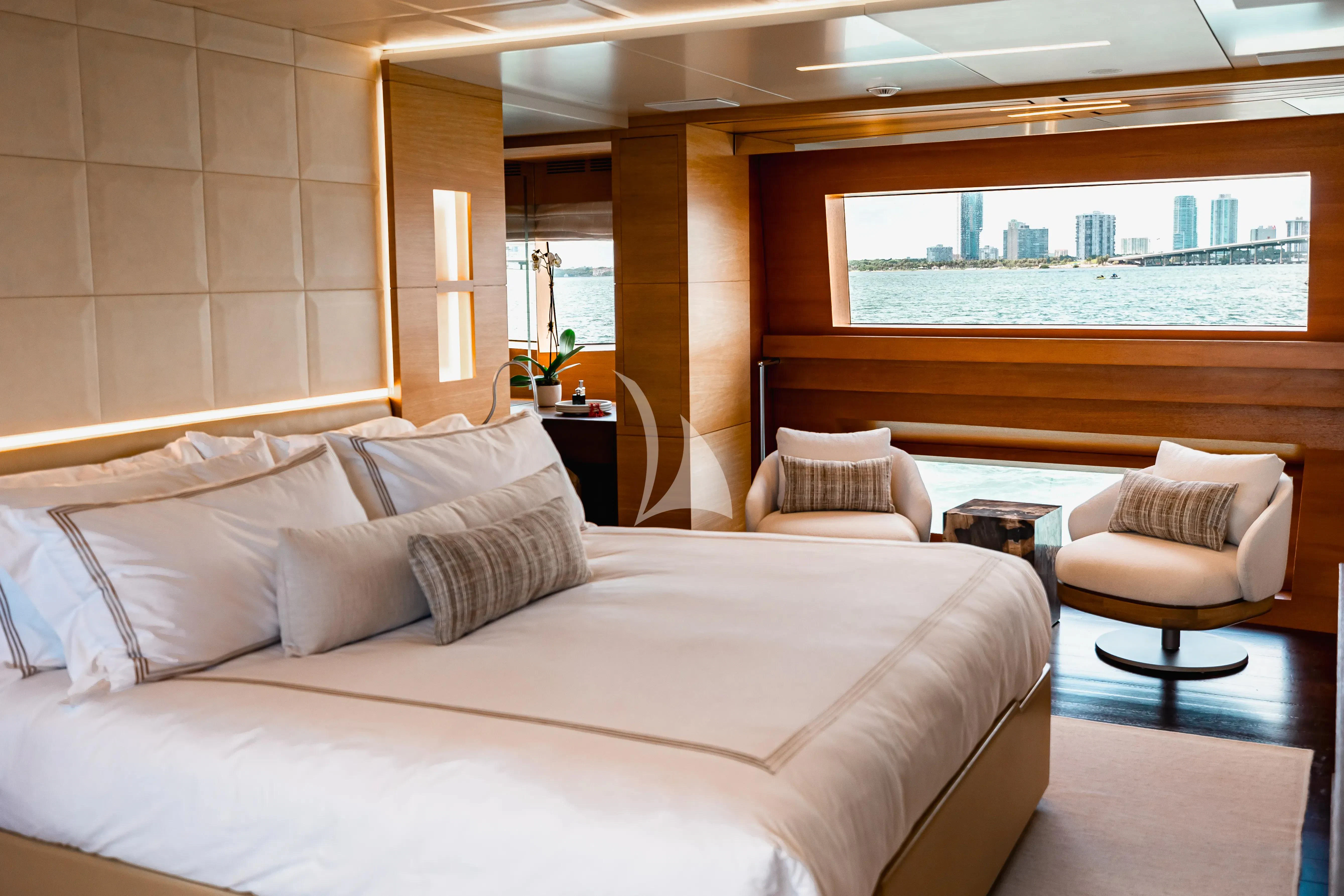 a room with a bed and a window aboard PATIENCE Yacht for Charter