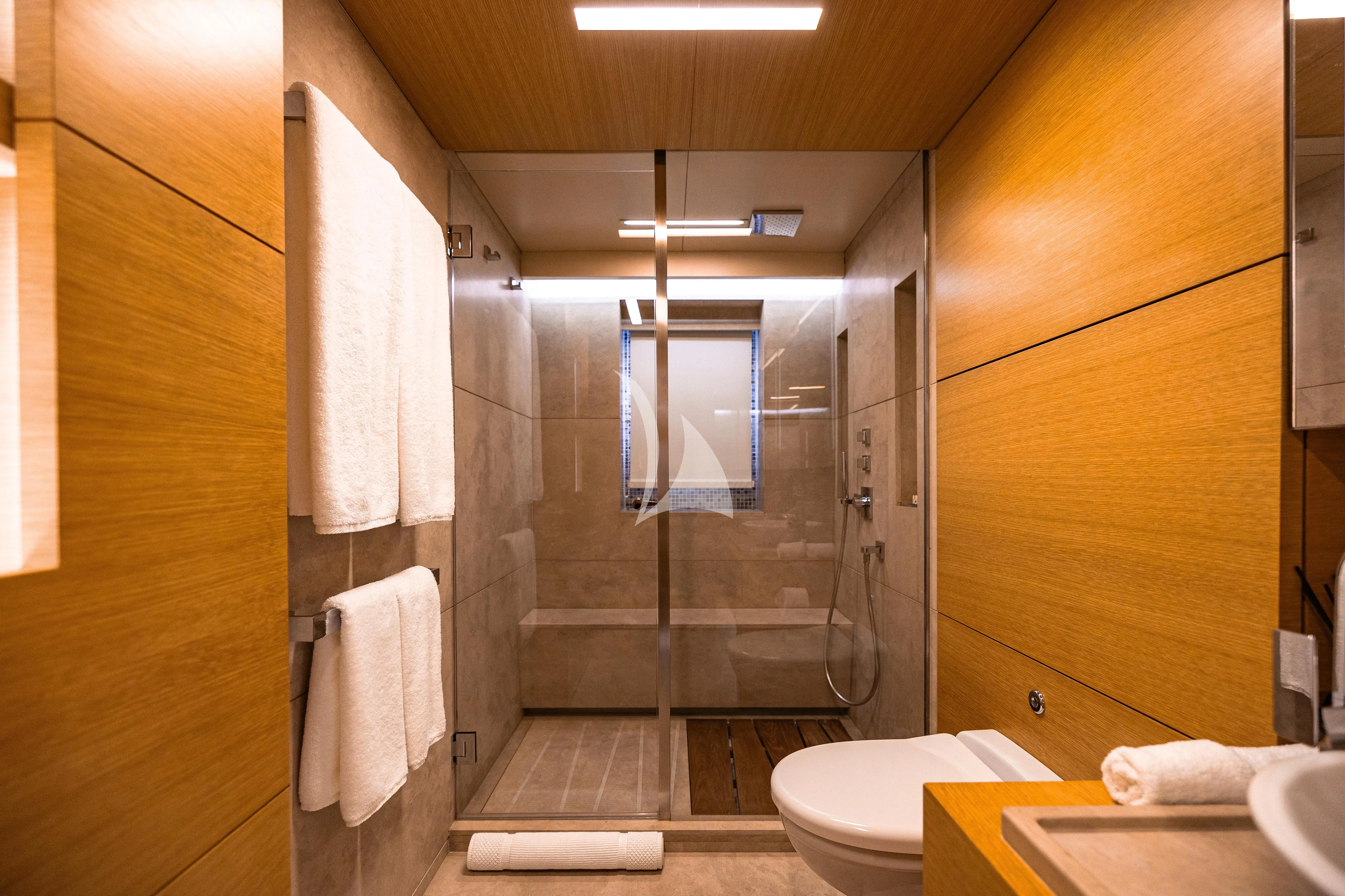 a bathroom with a glass shower aboard PATIENCE Yacht for Charter