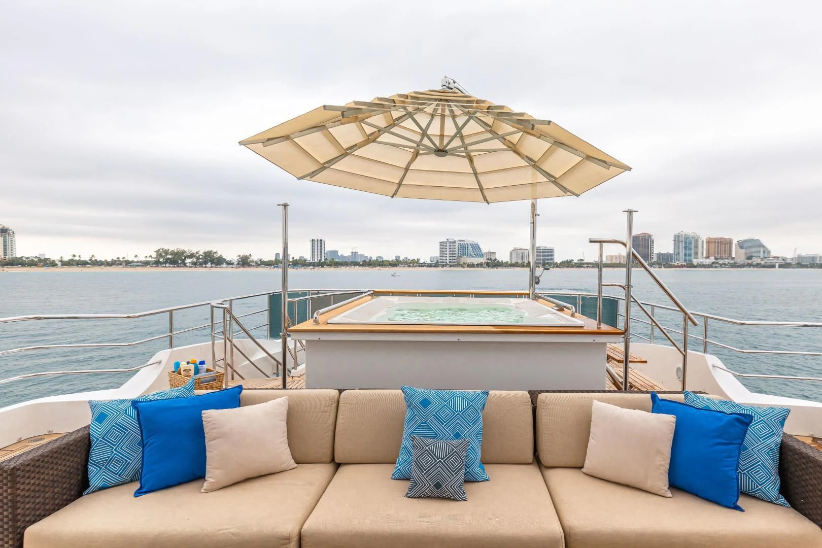 a lounge chair and umbrella on a boat aboard PATIENCE Yacht for Charter