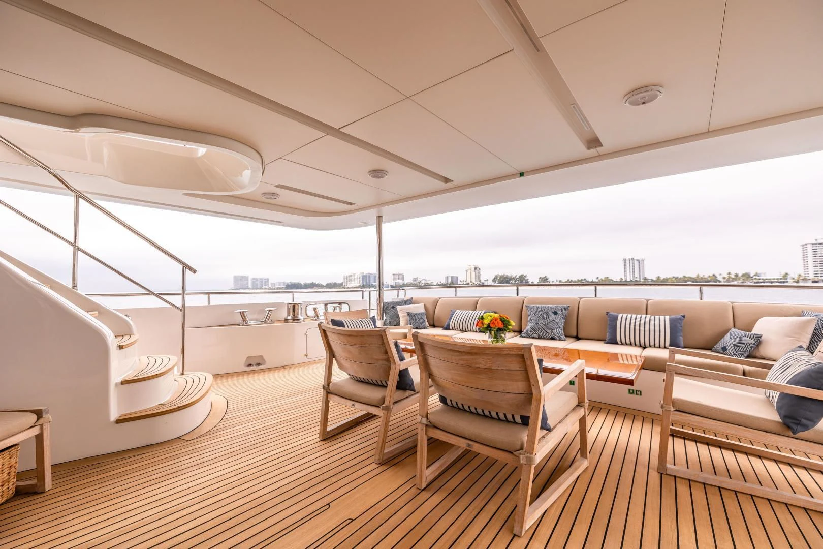 a room with a couch and a table and chairs aboard PATIENCE Yacht for Charter