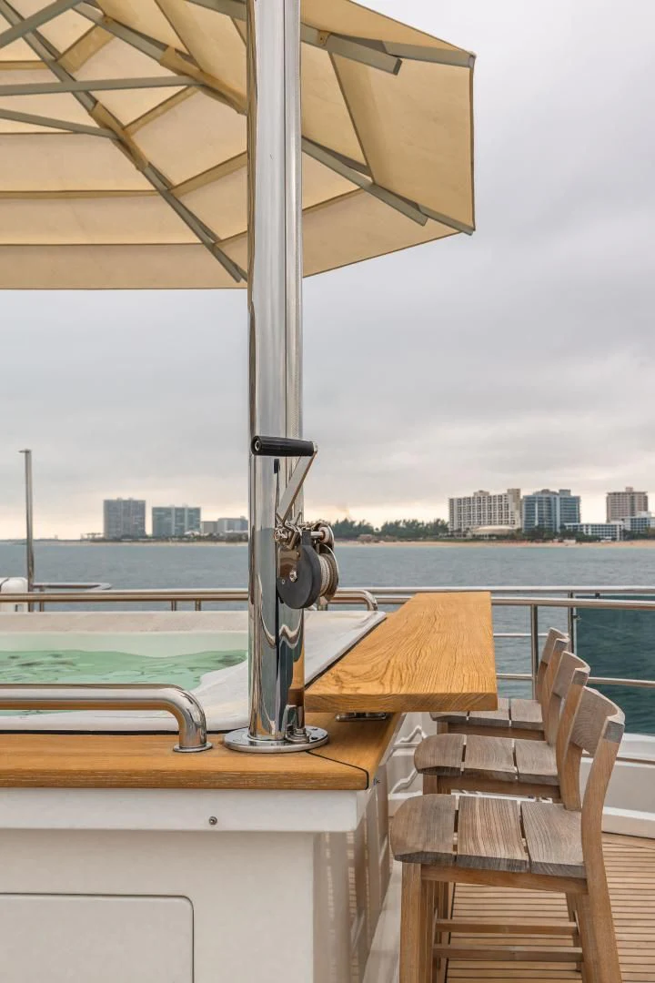 a water fountain with a city in the background aboard PATIENCE Yacht for Charter