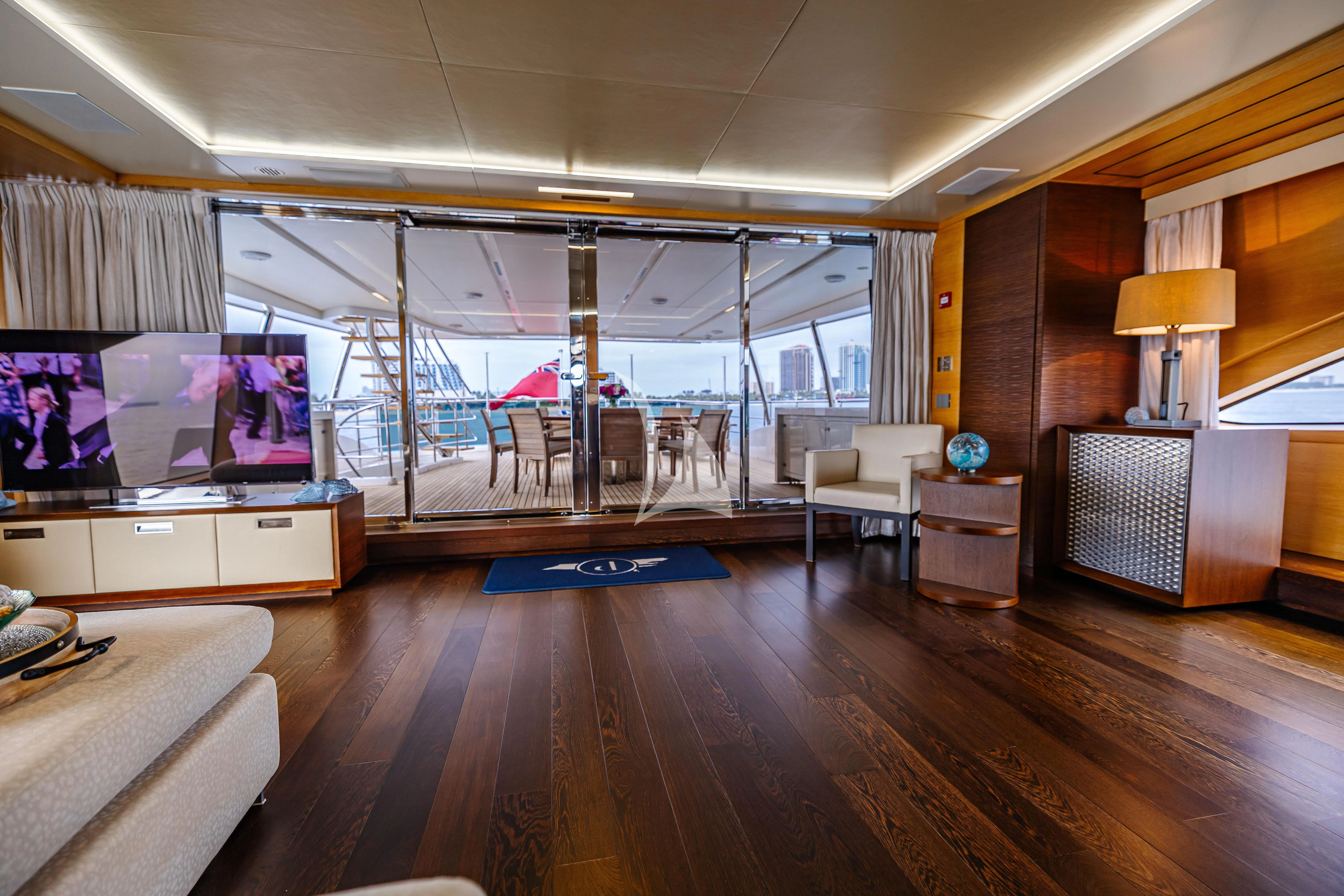 a room with a wood floor and a large window with a wood floor aboard PATIENCE Yacht for Charter
