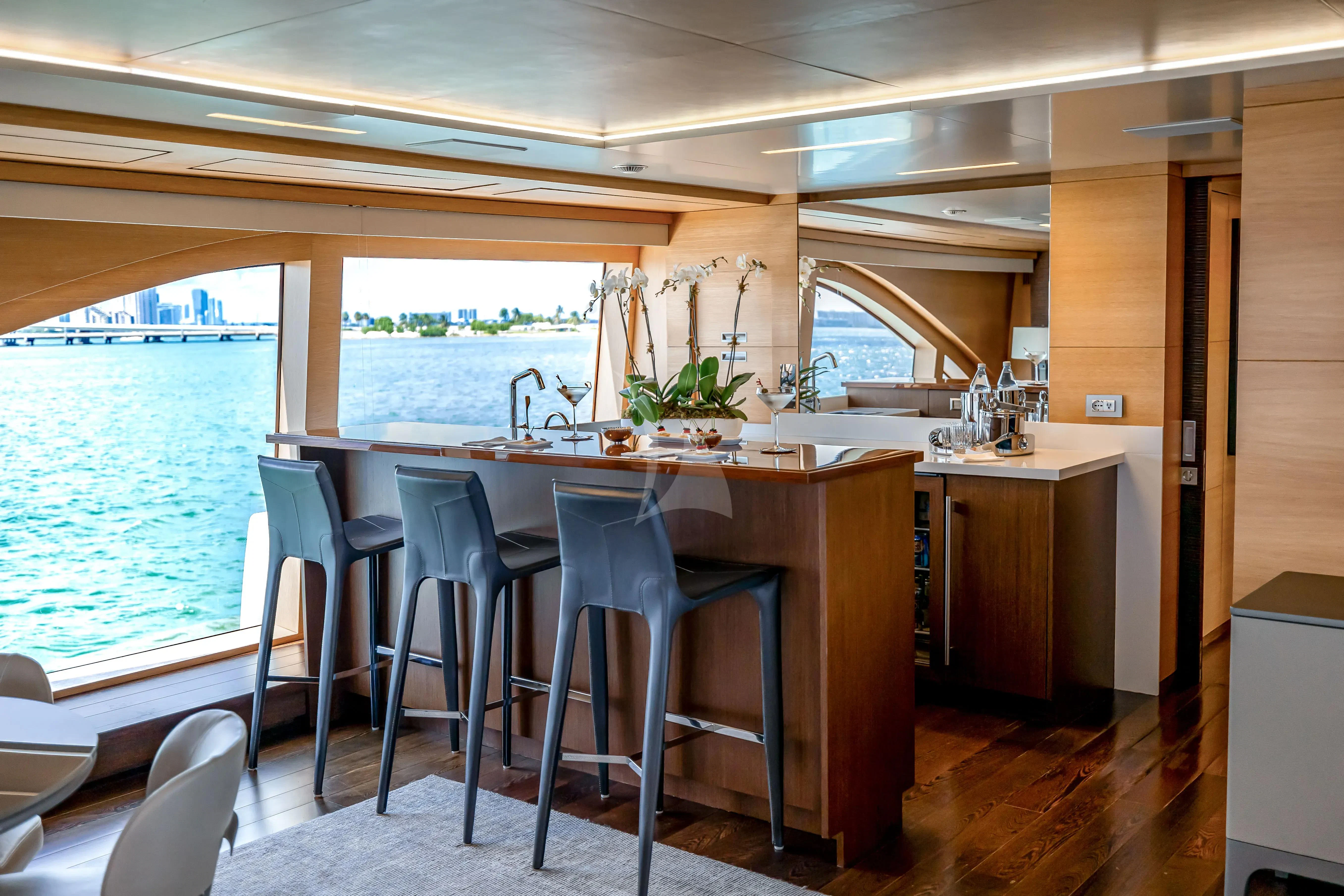 a kitchen with a table and chairs aboard PATIENCE Yacht for Charter