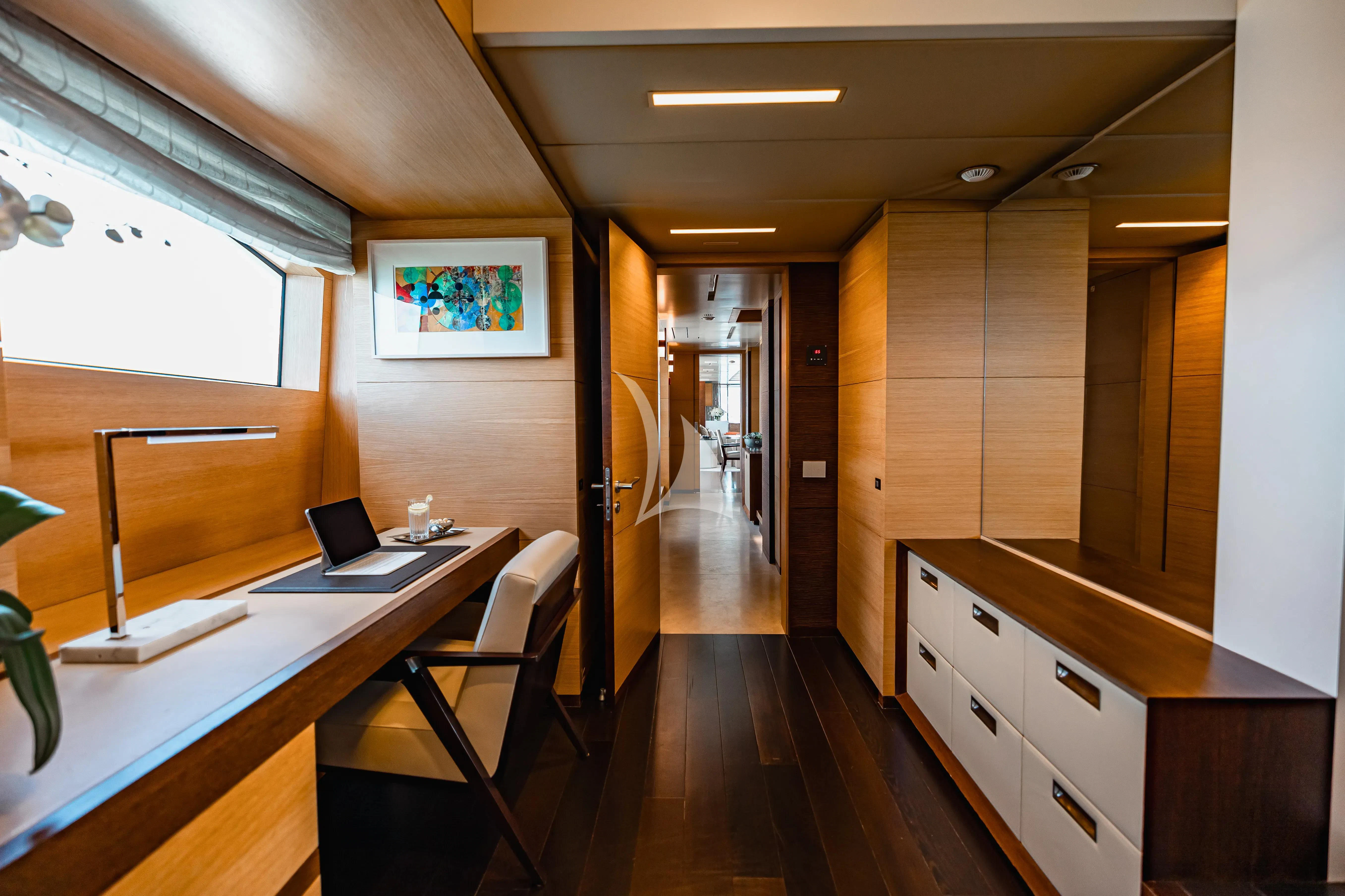 a room with a desk and a computer aboard PATIENCE Yacht for Charter