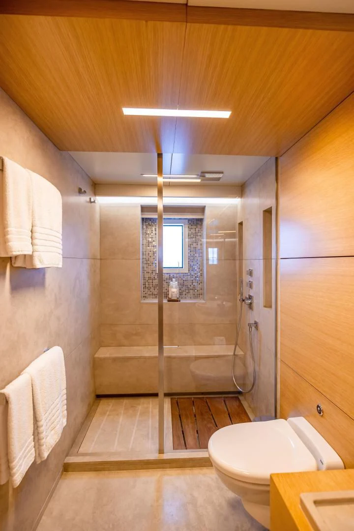 a bathroom with a glass shower aboard PATIENCE Yacht for Charter