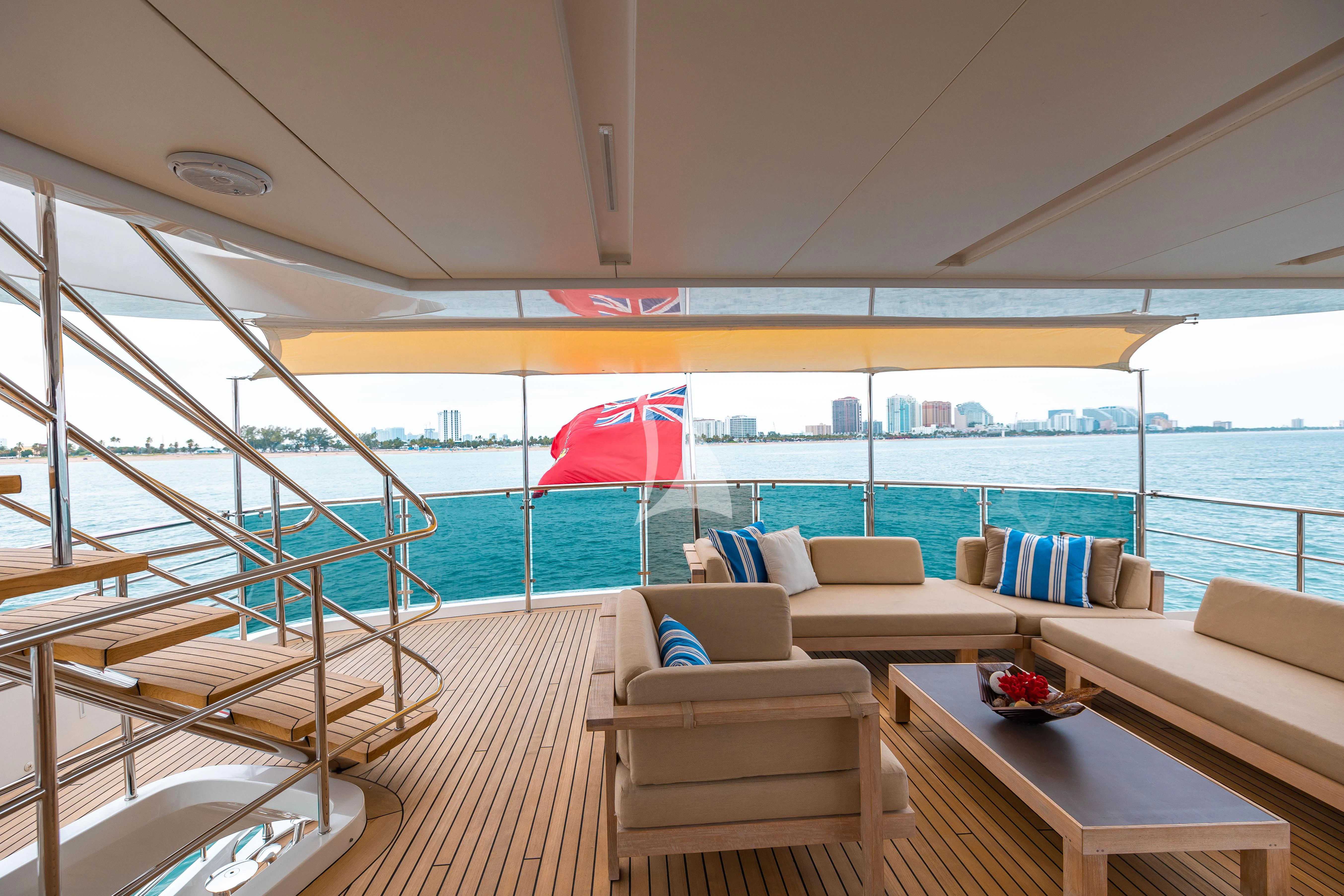 a boat with a couch and a table on it aboard PATIENCE Yacht for Charter