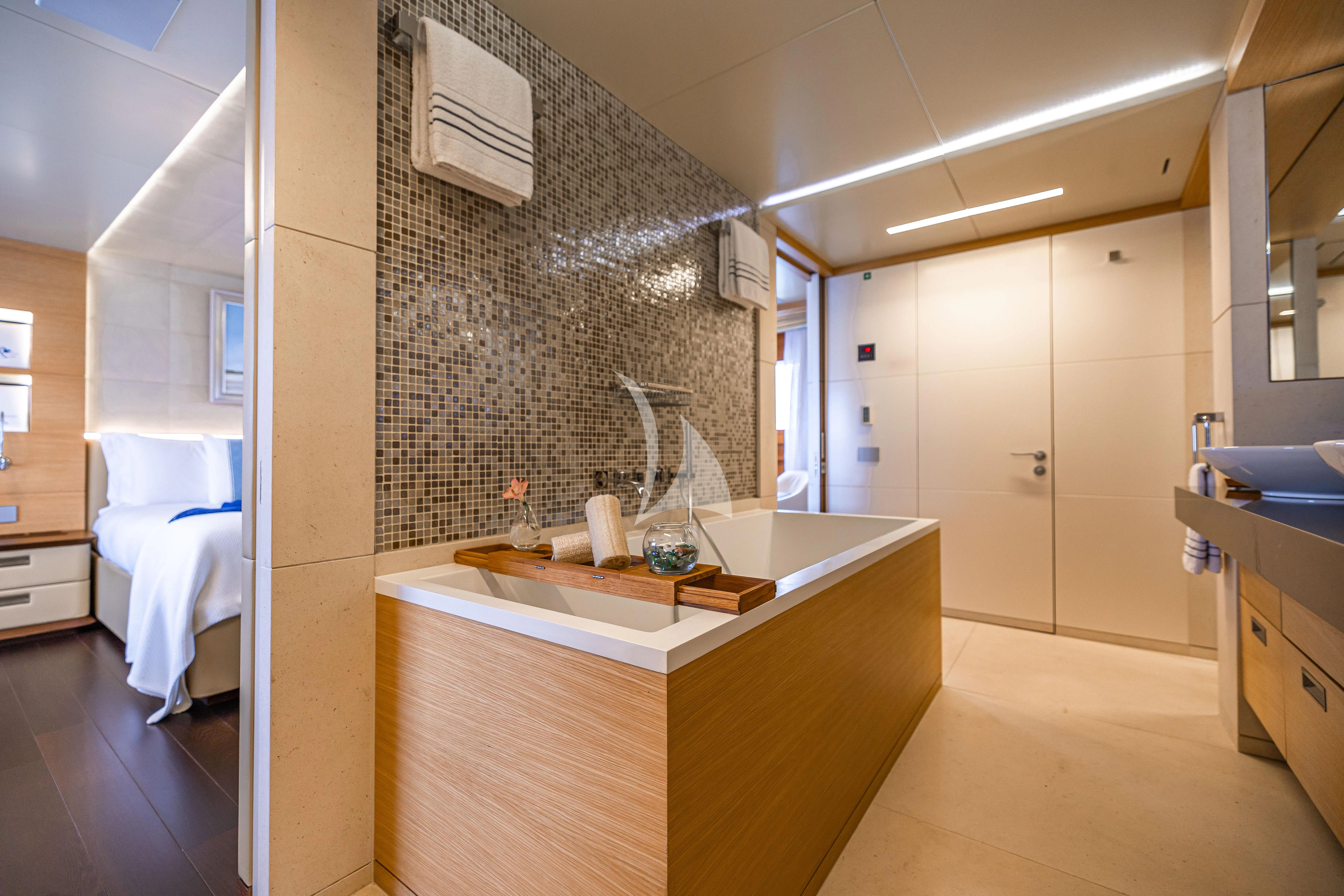 a bathroom with a sink and a bathtub aboard PATIENCE Yacht for Charter