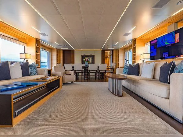 a living room with a couch and a tv aboard PATIENCE Yacht for Charter