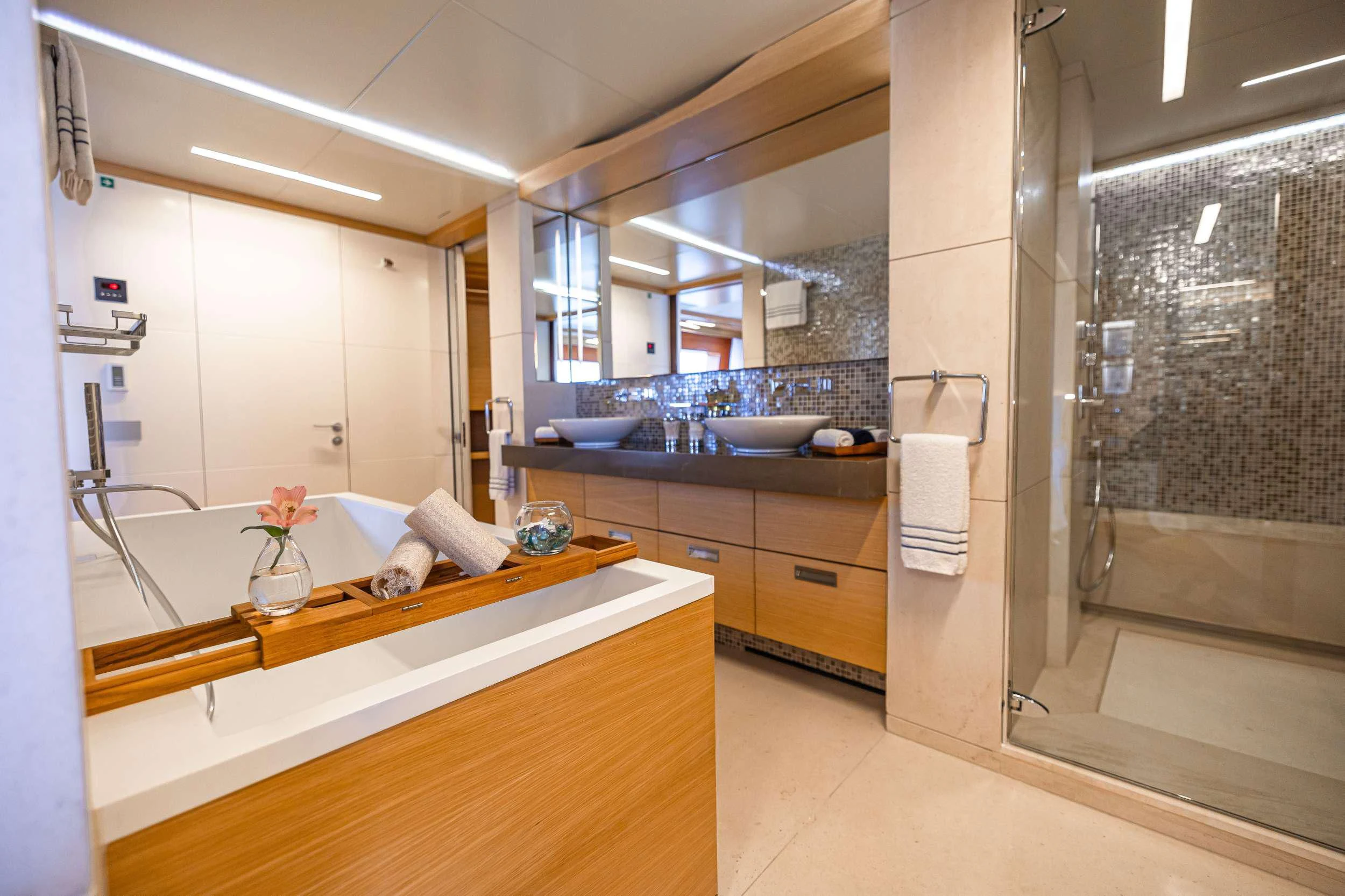 a bathroom with a large mirror aboard PATIENCE Yacht for Charter