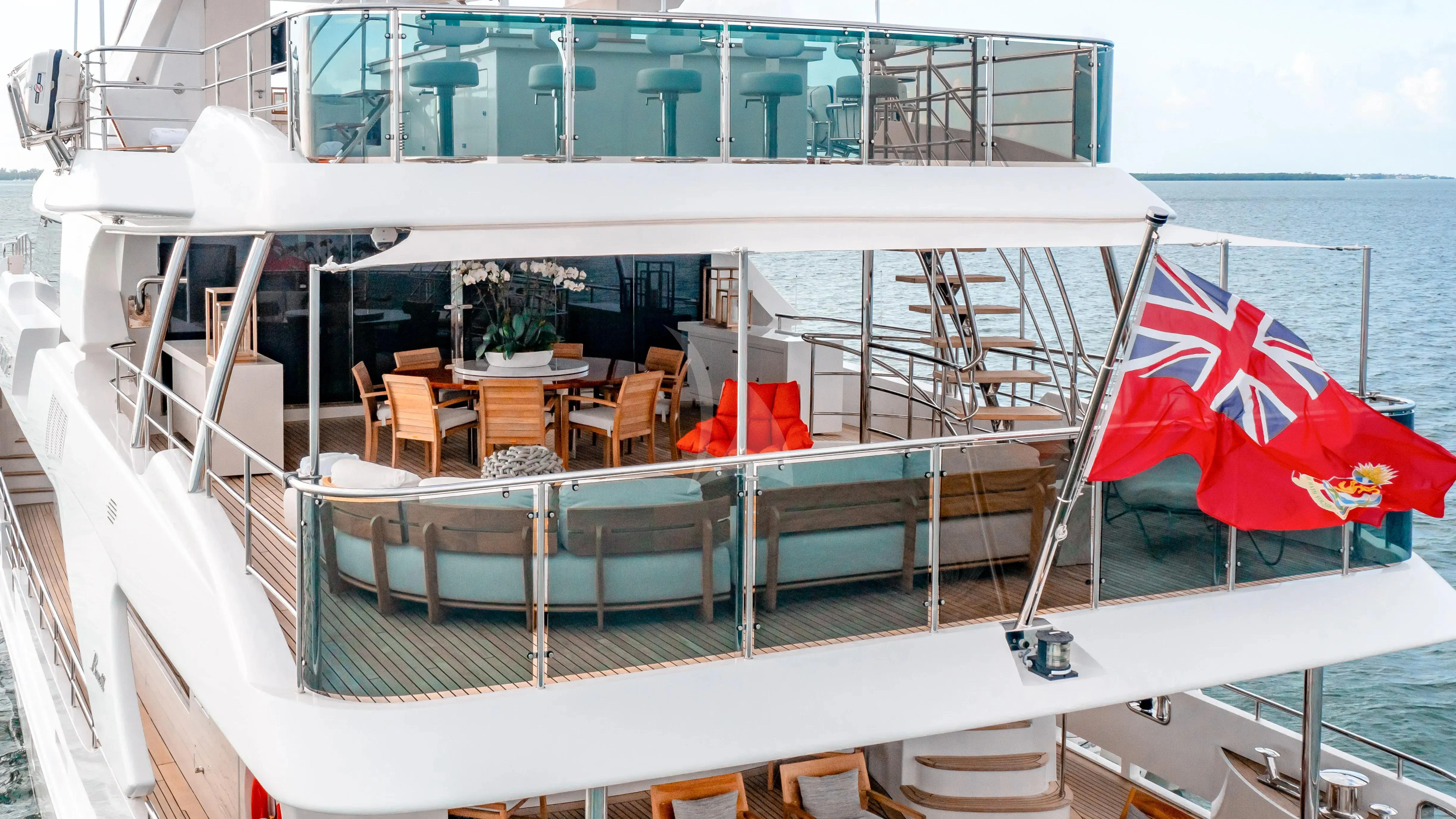 a deck with chairs and tables on it aboard PATIENCE Yacht for Charter