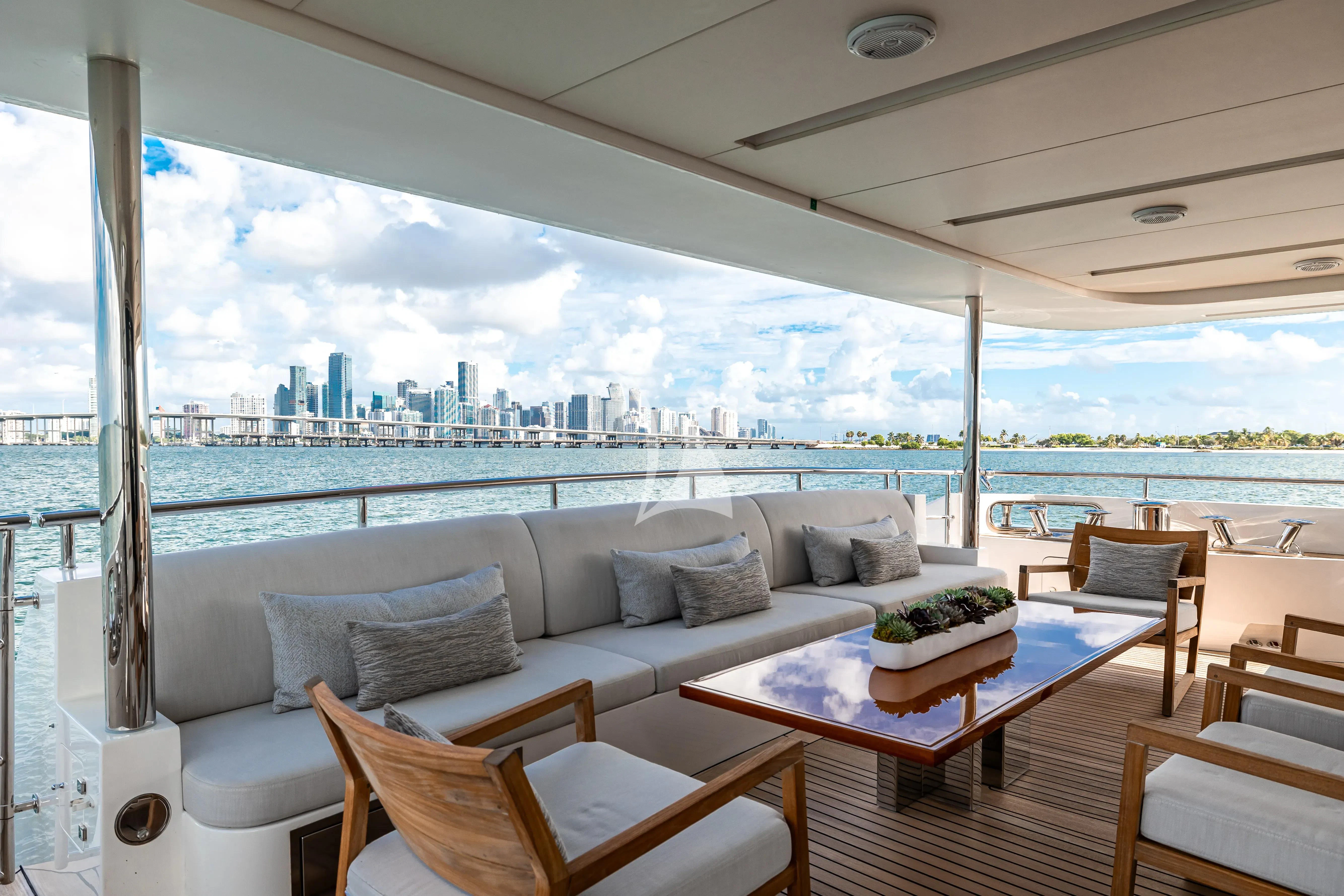 a living room with a large window aboard PATIENCE Yacht for Charter