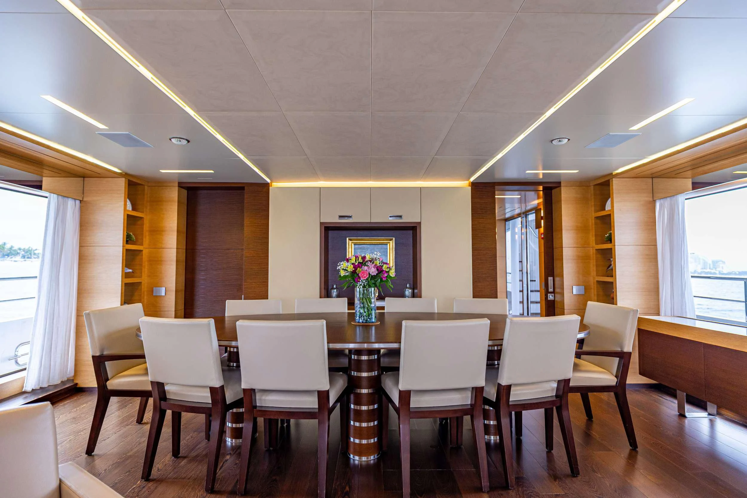 a dining table with chairs aboard PATIENCE Yacht for Charter