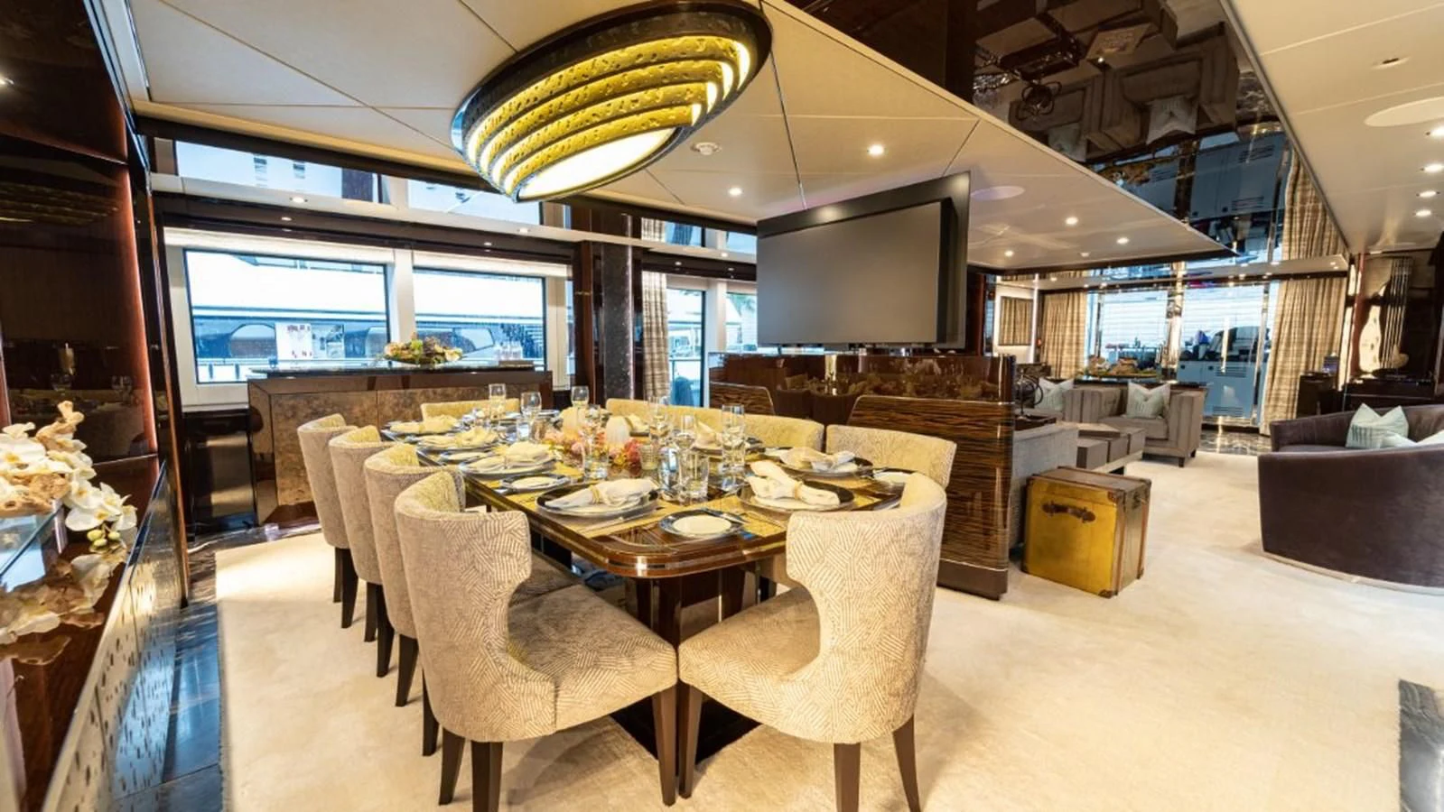 a large dining room with a table and chairs aboard NEXUS Yacht for Charter