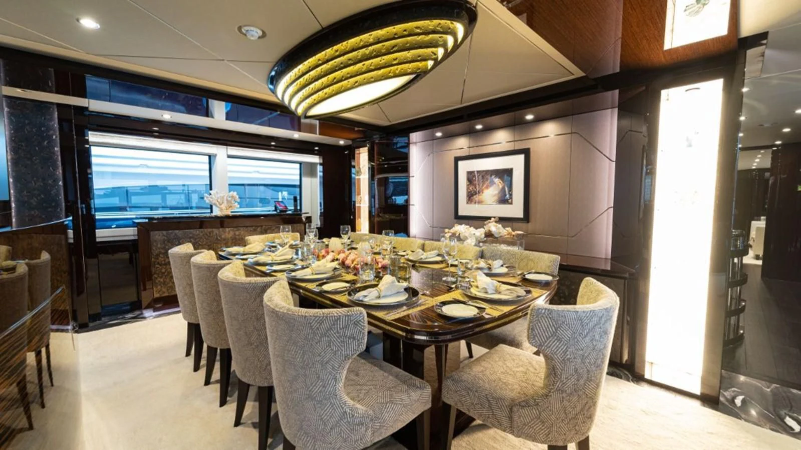 a dining room with a table and chairs aboard NEXUS Yacht for Charter