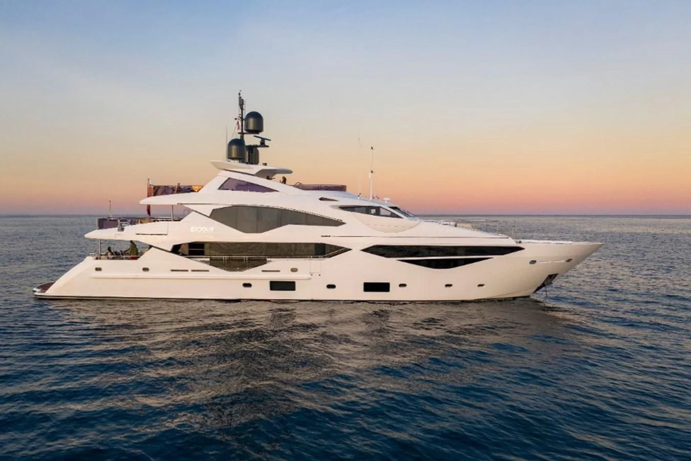 a white yacht in the water aboard NEXUS Yacht for Charter
