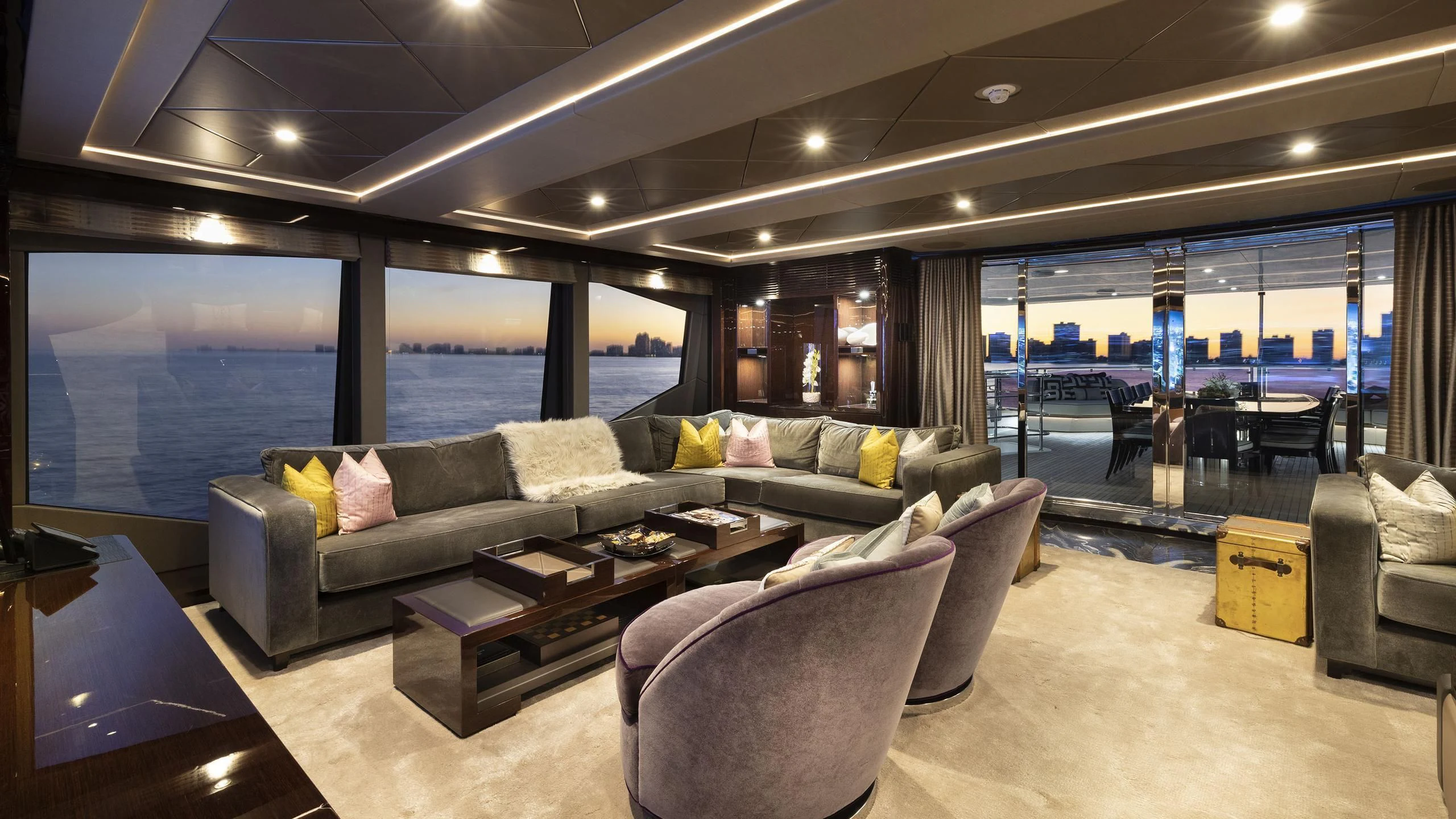 a living room with a large window aboard NEXUS Yacht for Charter