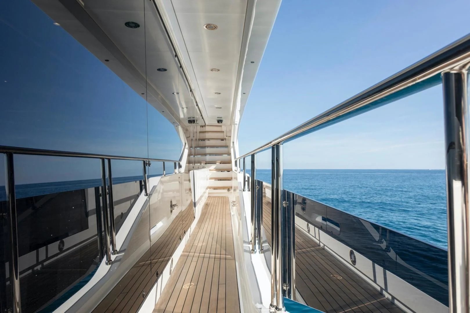a wooden walkway over water aboard NEXUS Yacht for Charter