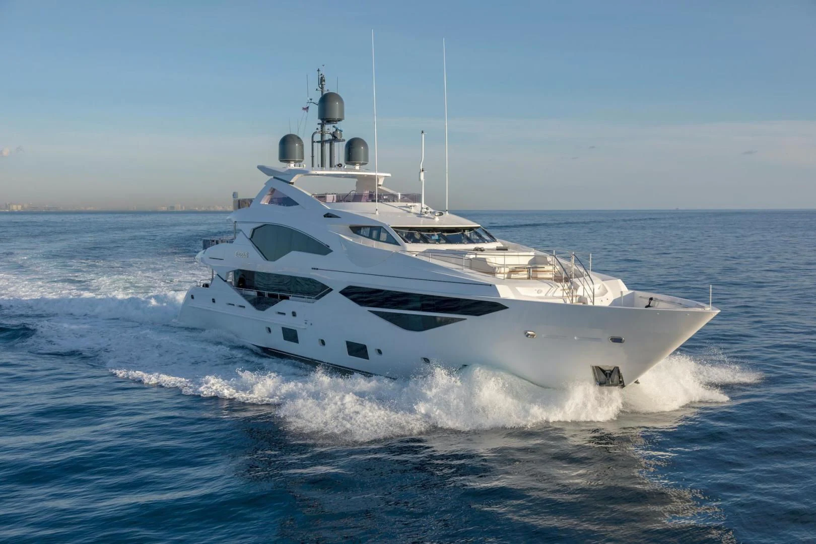 a white yacht in the water aboard NEXUS Yacht for Charter