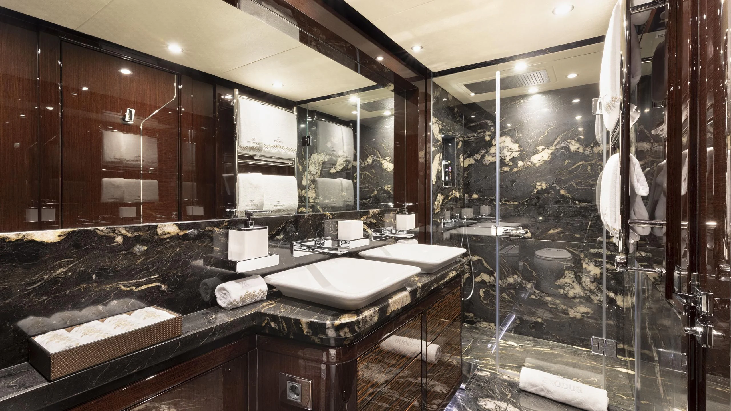 a bathroom with a large mirror aboard NEXUS Yacht for Charter