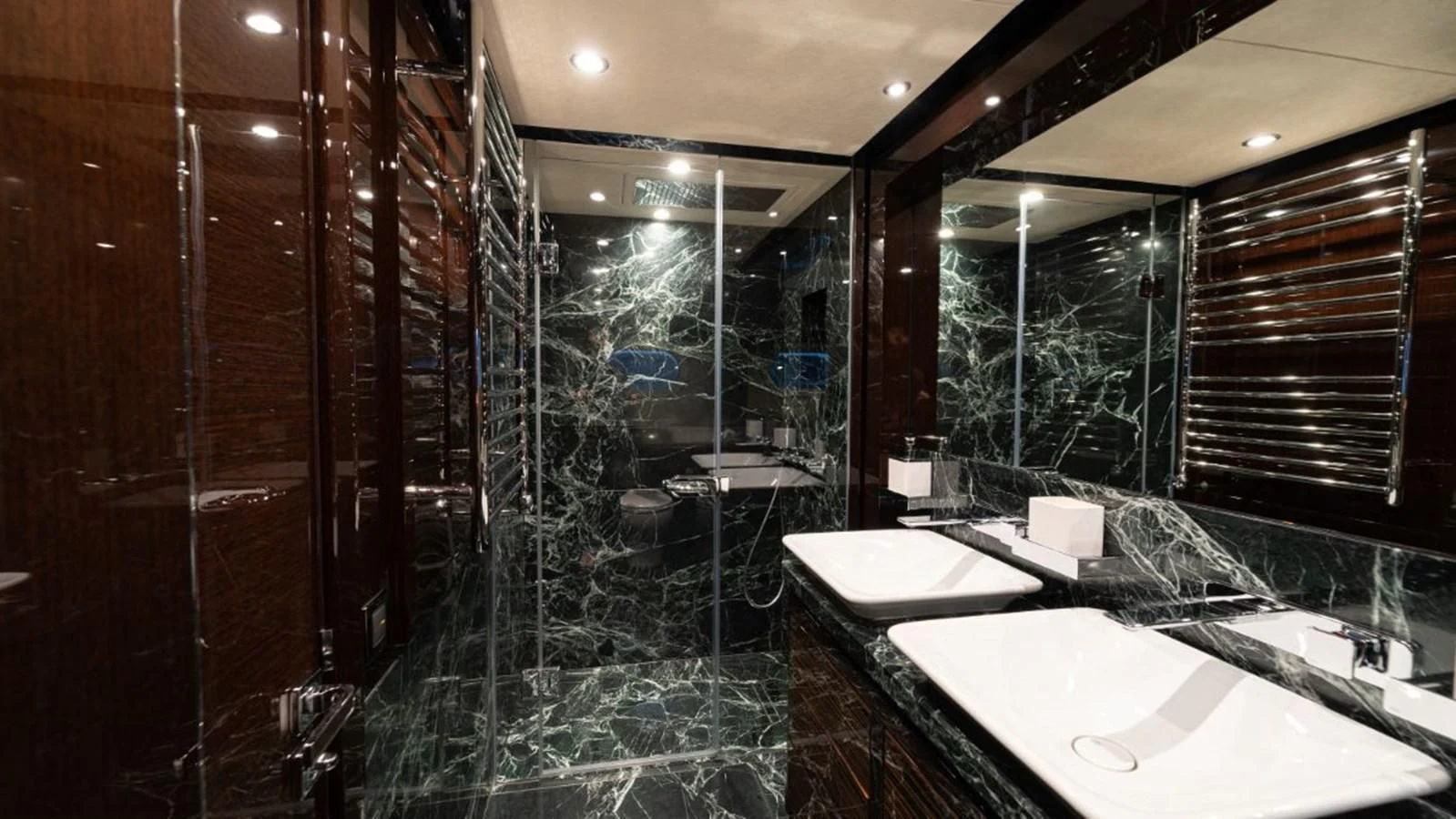 a bathroom with a glass shower aboard NEXUS Yacht for Charter