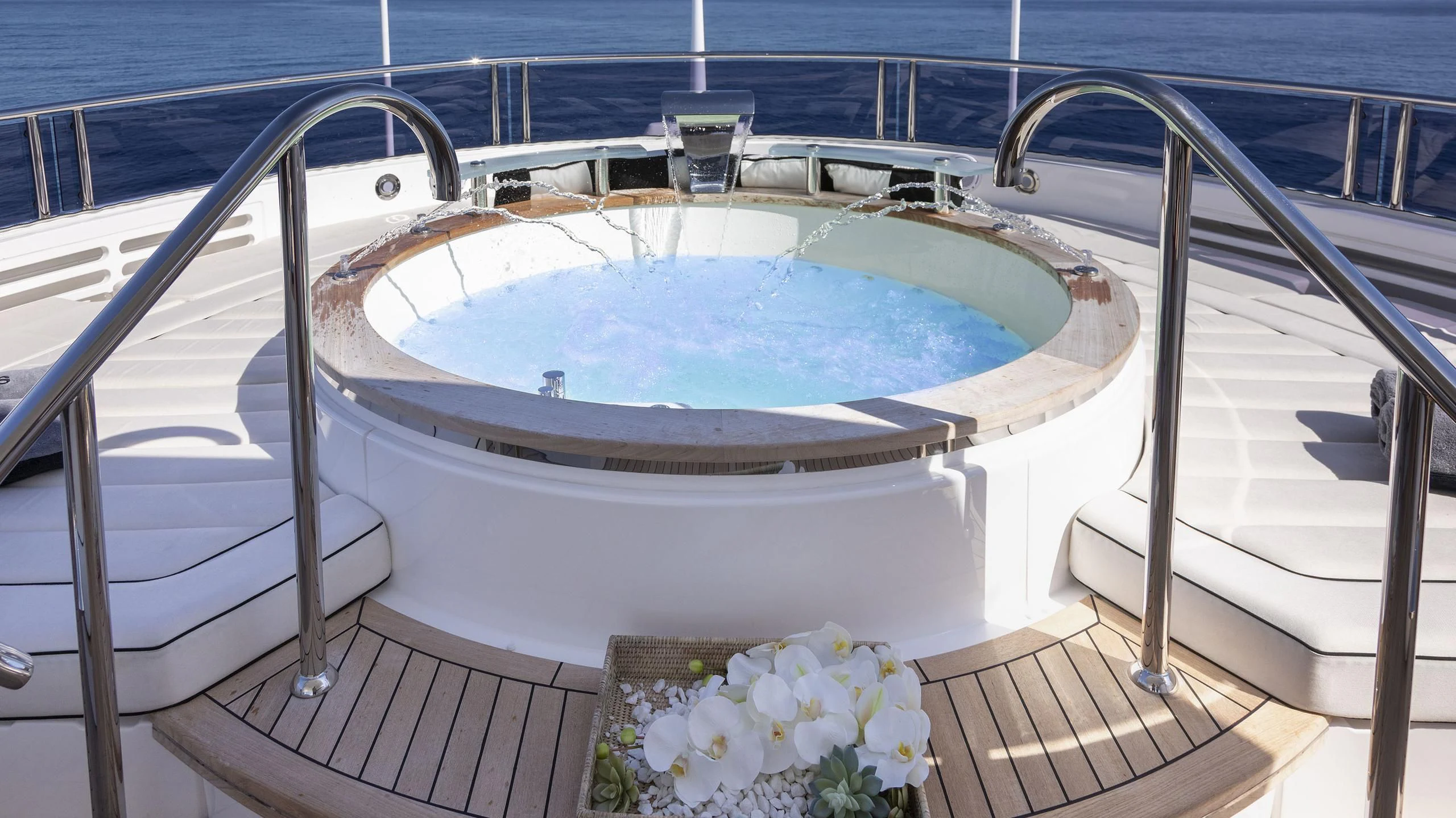 a large swimming pool aboard NEXUS Yacht for Charter