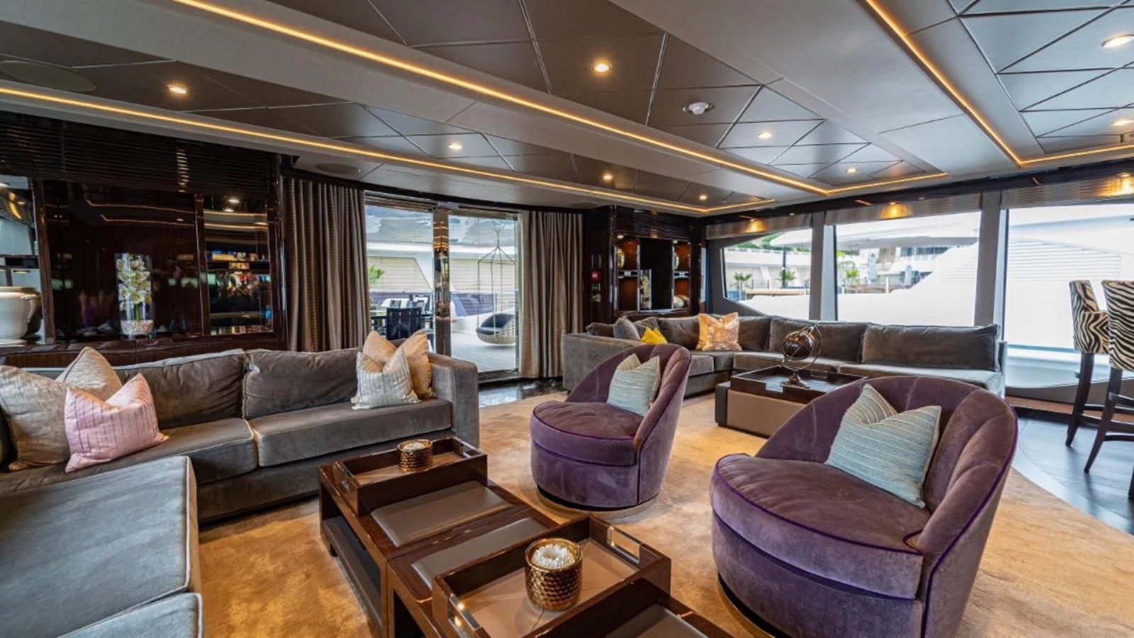 a living room with a large window aboard NEXUS Yacht for Charter