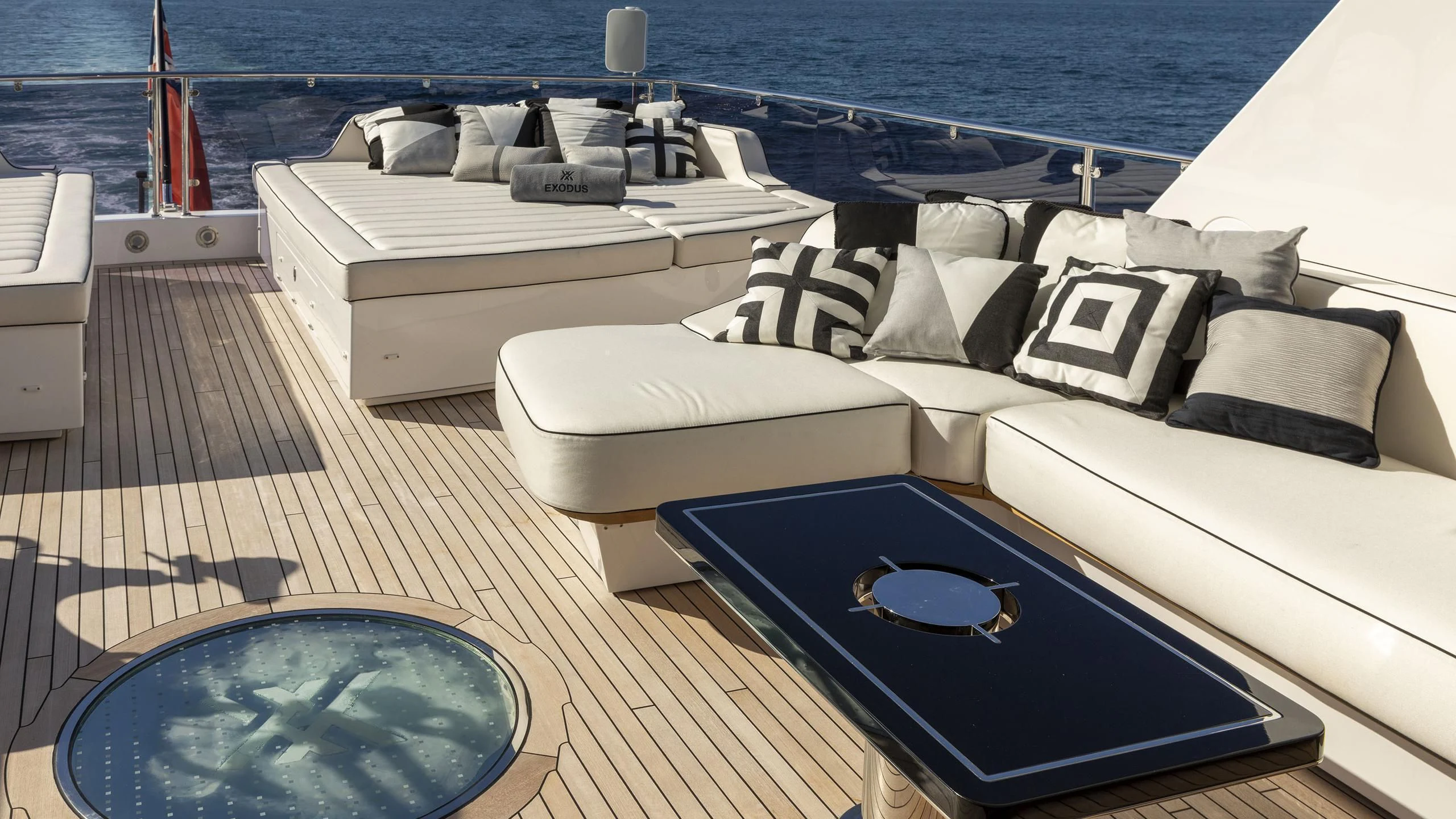a group of beds on a deck aboard NEXUS Yacht for Charter