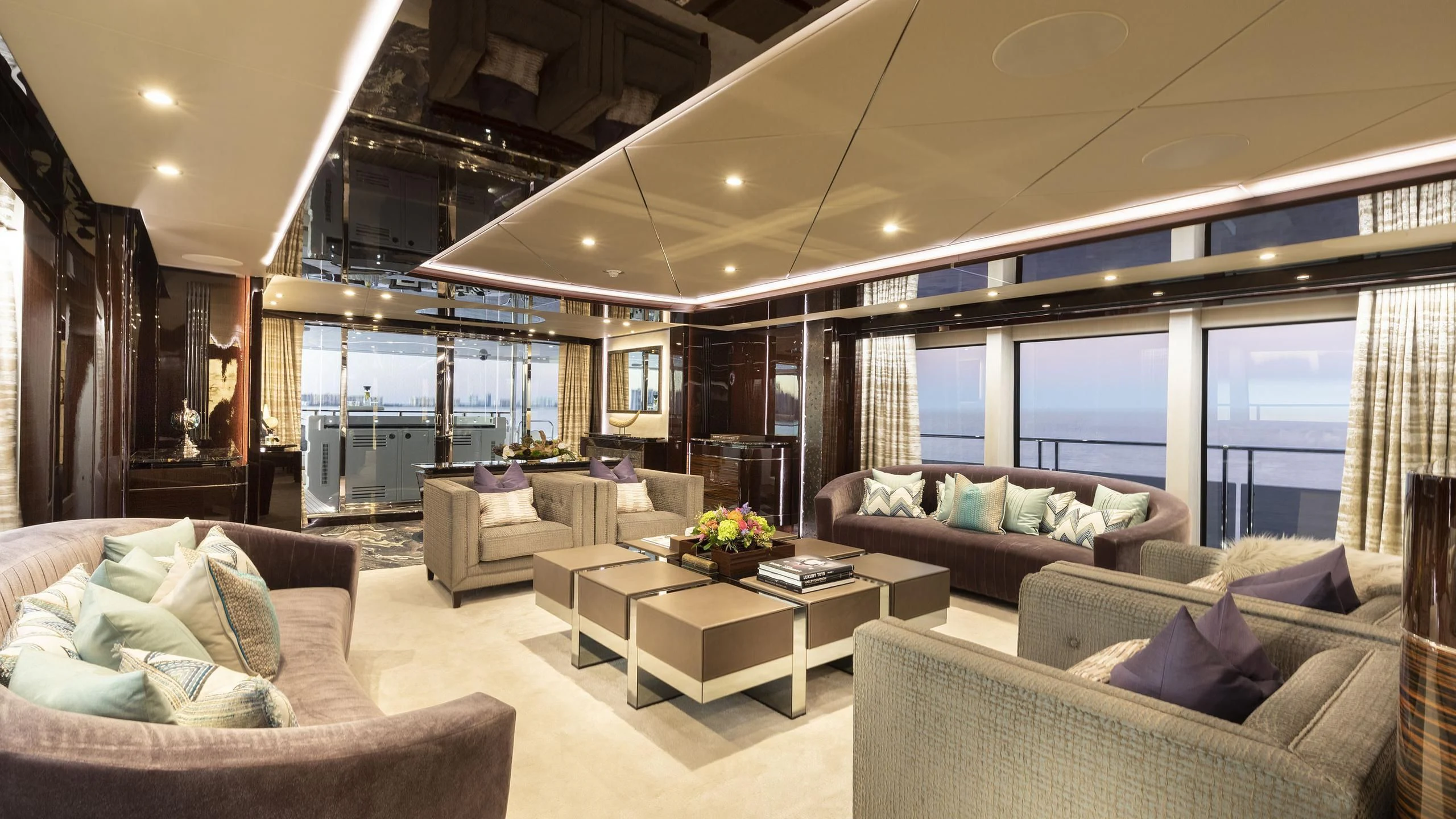 a living room with a large window aboard NEXUS Yacht for Charter