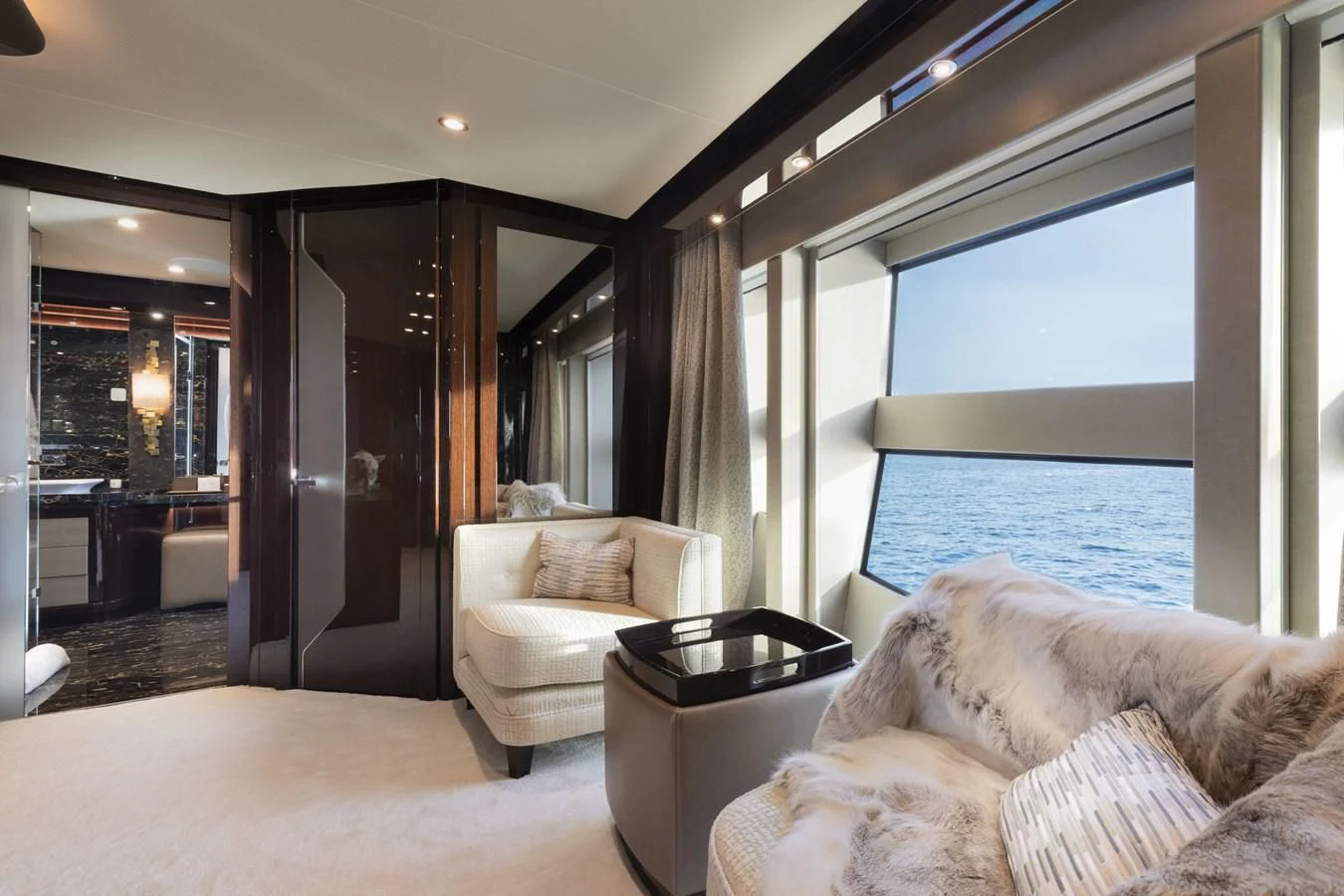 a living room with a large window aboard NEXUS Yacht for Charter